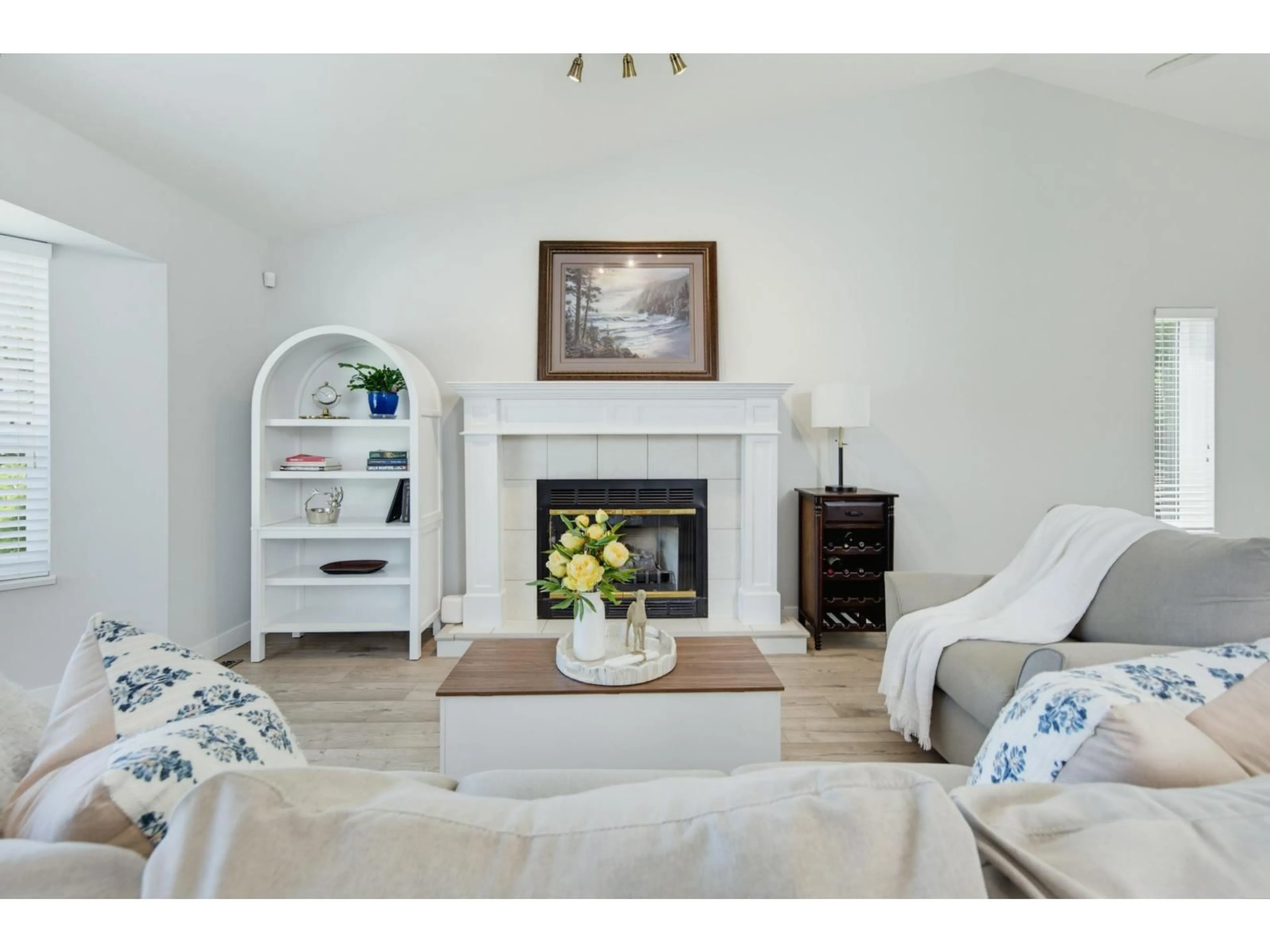 Living room with furniture, wood/laminate floor for 4529 217A STREET, Langley British Columbia V3A8E7