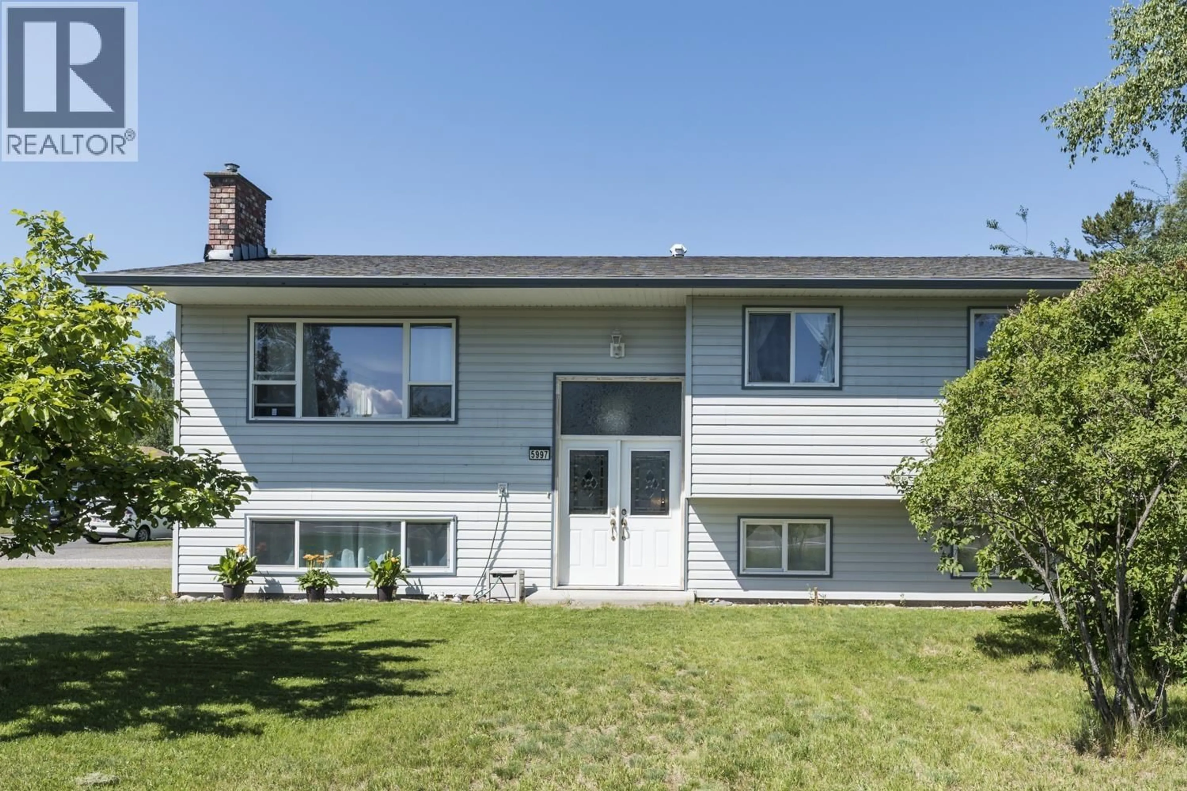 Home with vinyl exterior material, street for 5997 SIMON FRASER AVENUE, Prince George British Columbia V2N2C7