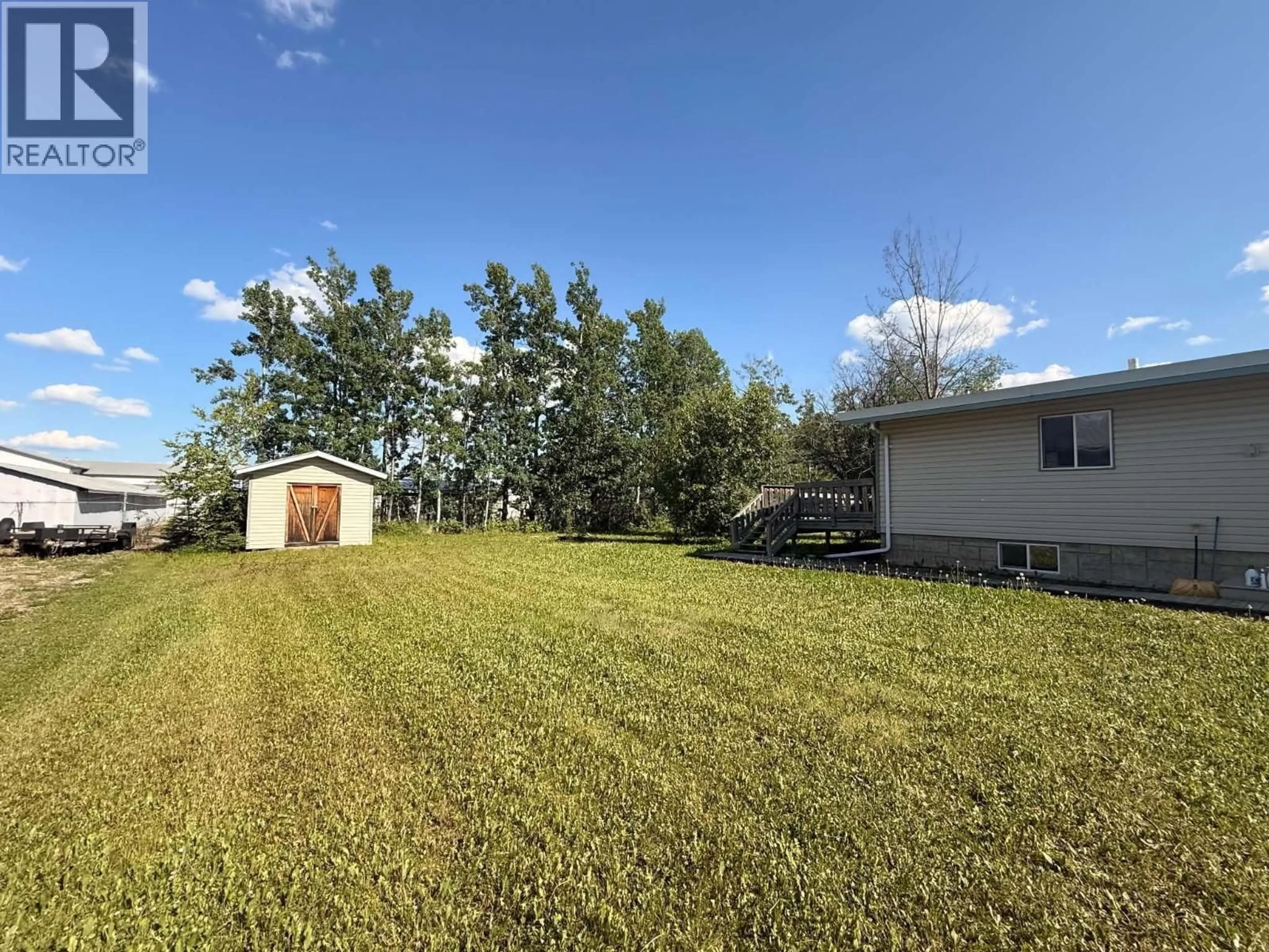 A pic from outside/outdoor area/front of a property/back of a property/a pic from drone, water/lake/river/ocean view for 12224 242 ROAD, Fort St. John British Columbia V1J8A9