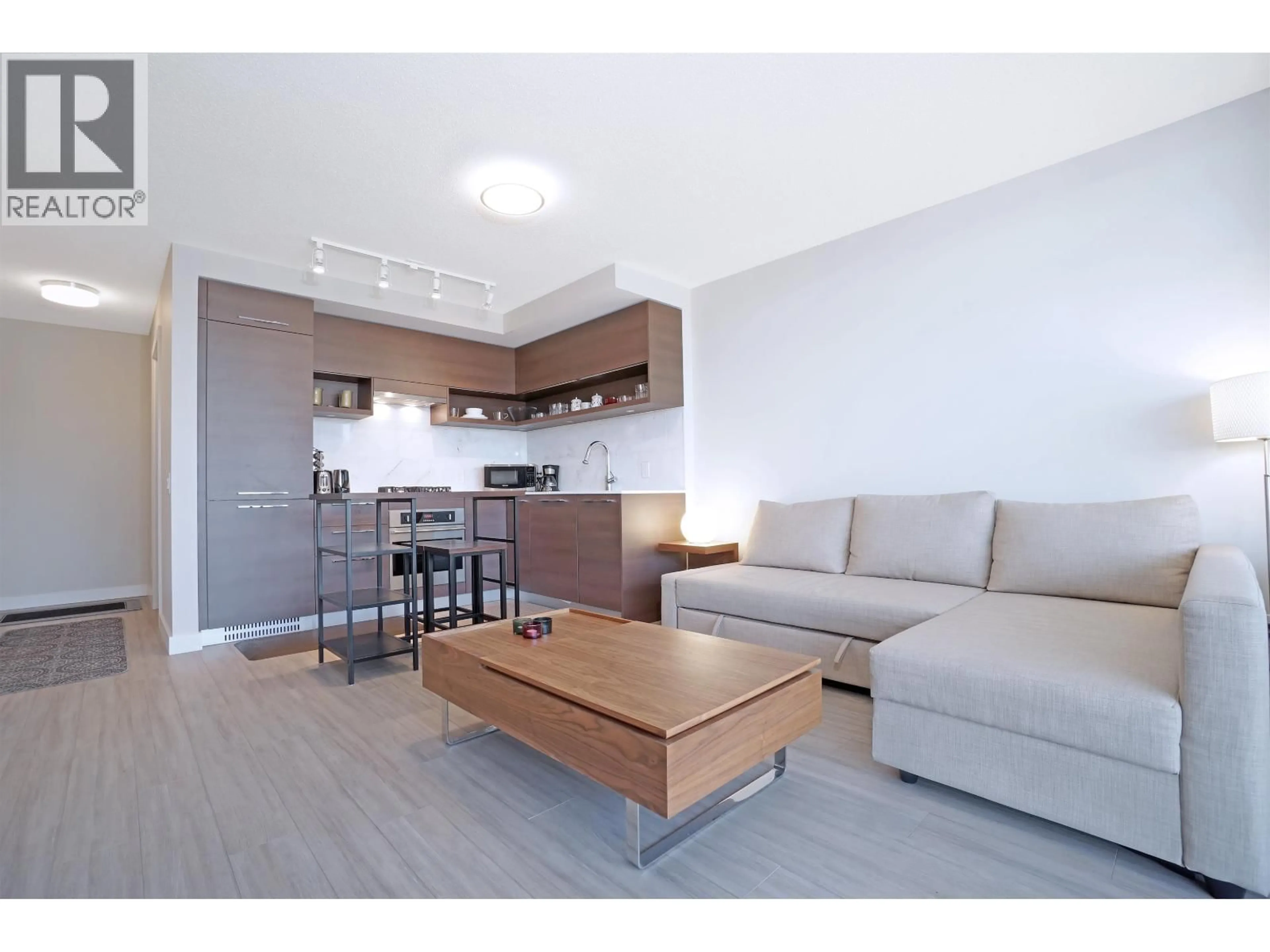 Living room with furniture, wood/laminate floor for 2606 - 570 EMERSON STREET, Coquitlam British Columbia V3J0G3