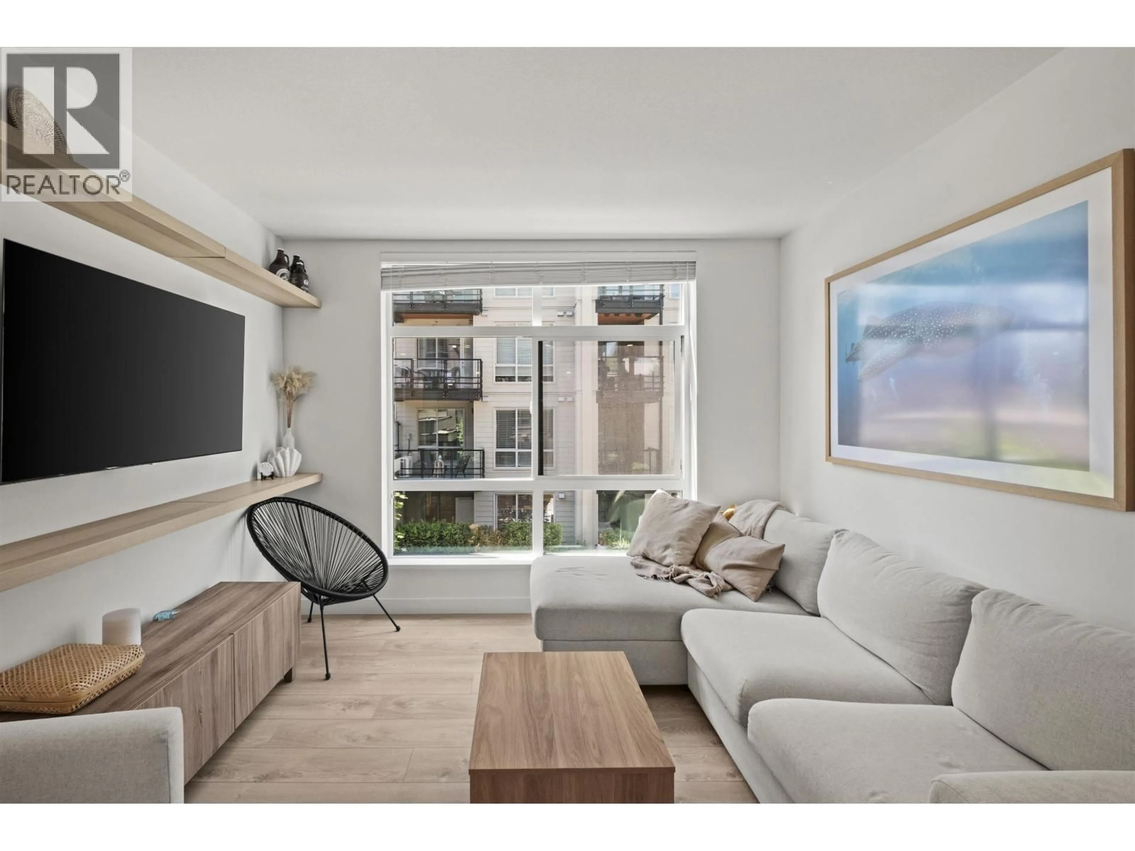 Living room with furniture, unknown for 209 - 128 8TH STREET, North Vancouver British Columbia V7L0H2