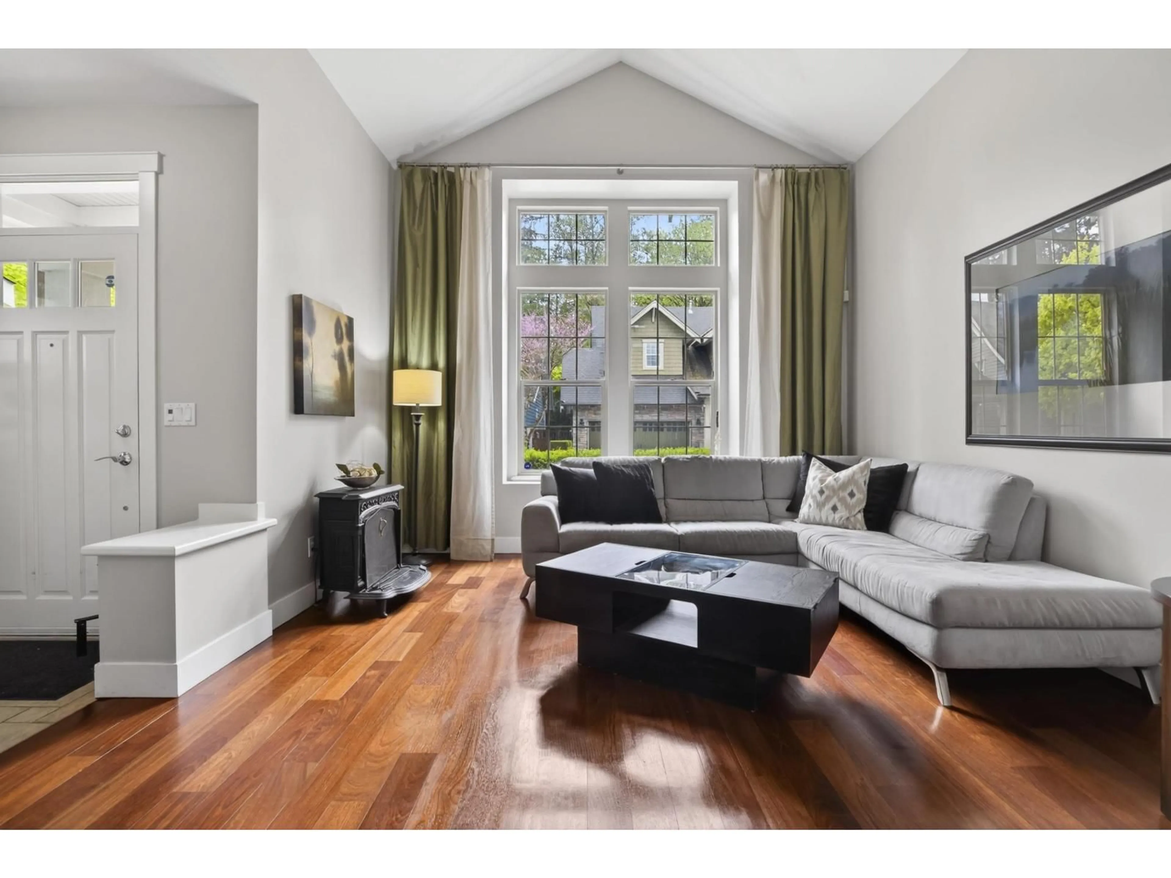 Living room with furniture, wood/laminate floor for 14273 36A AVENUE, Surrey British Columbia V4P0C2