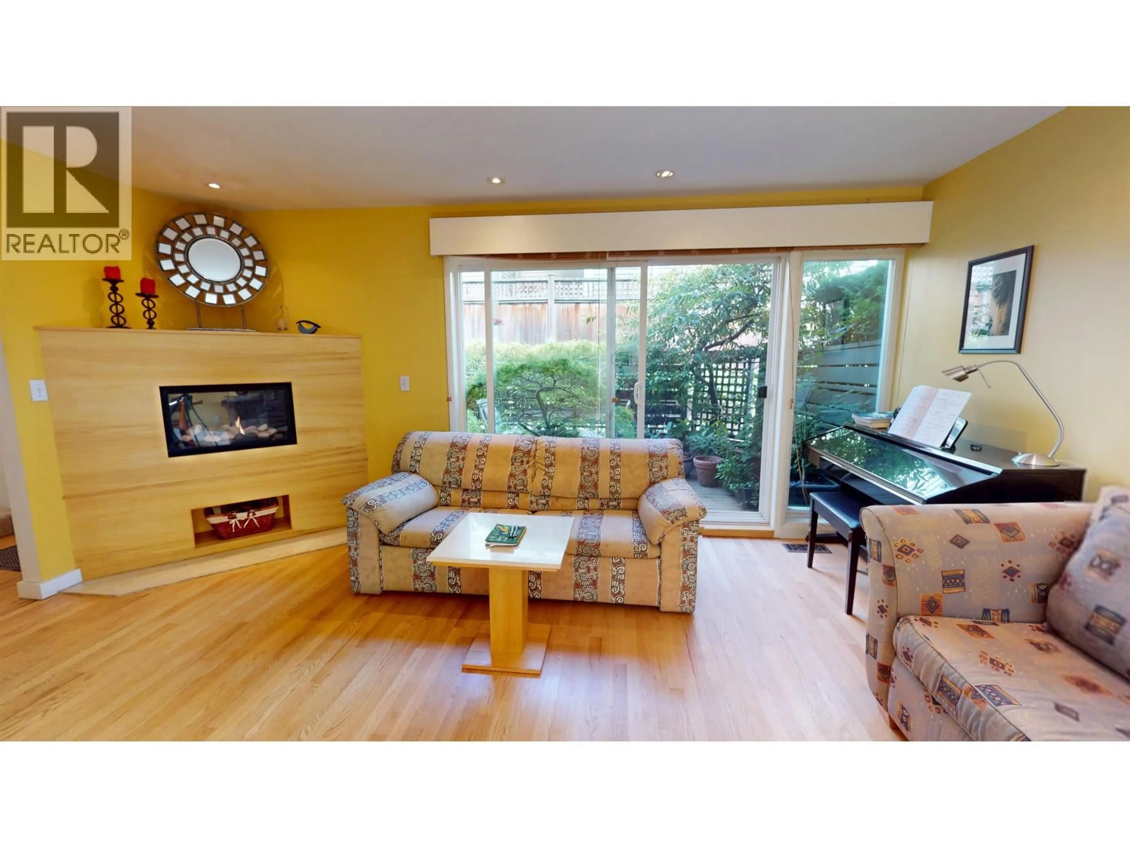 Living room with furniture, wood/laminate floor for 1339 CHESTNUT STREET, Vancouver British Columbia V6J3K1
