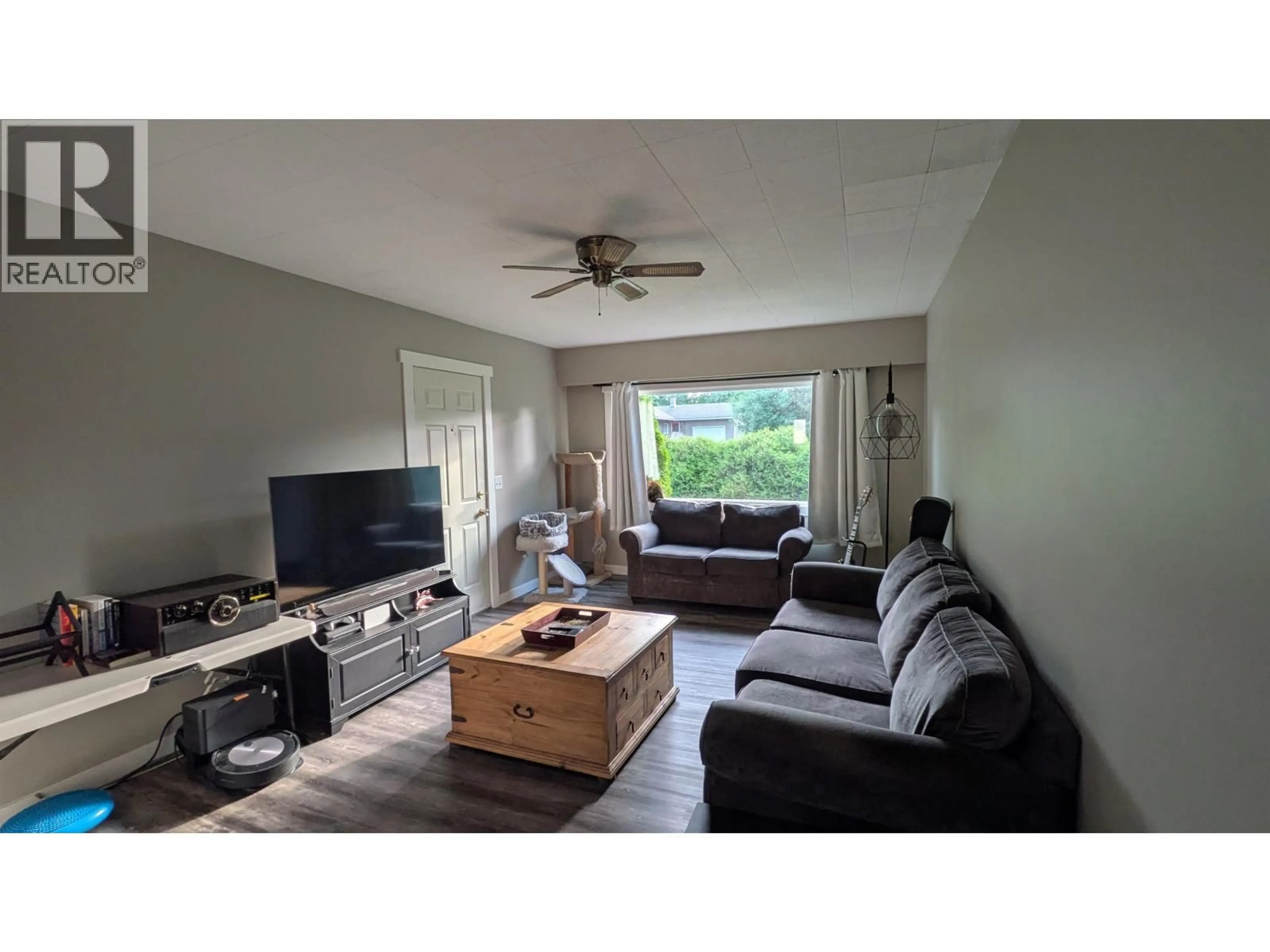 Living room with furniture, wood/laminate floor for 6954 IRENE ROAD, Prince George British Columbia V2N5P2