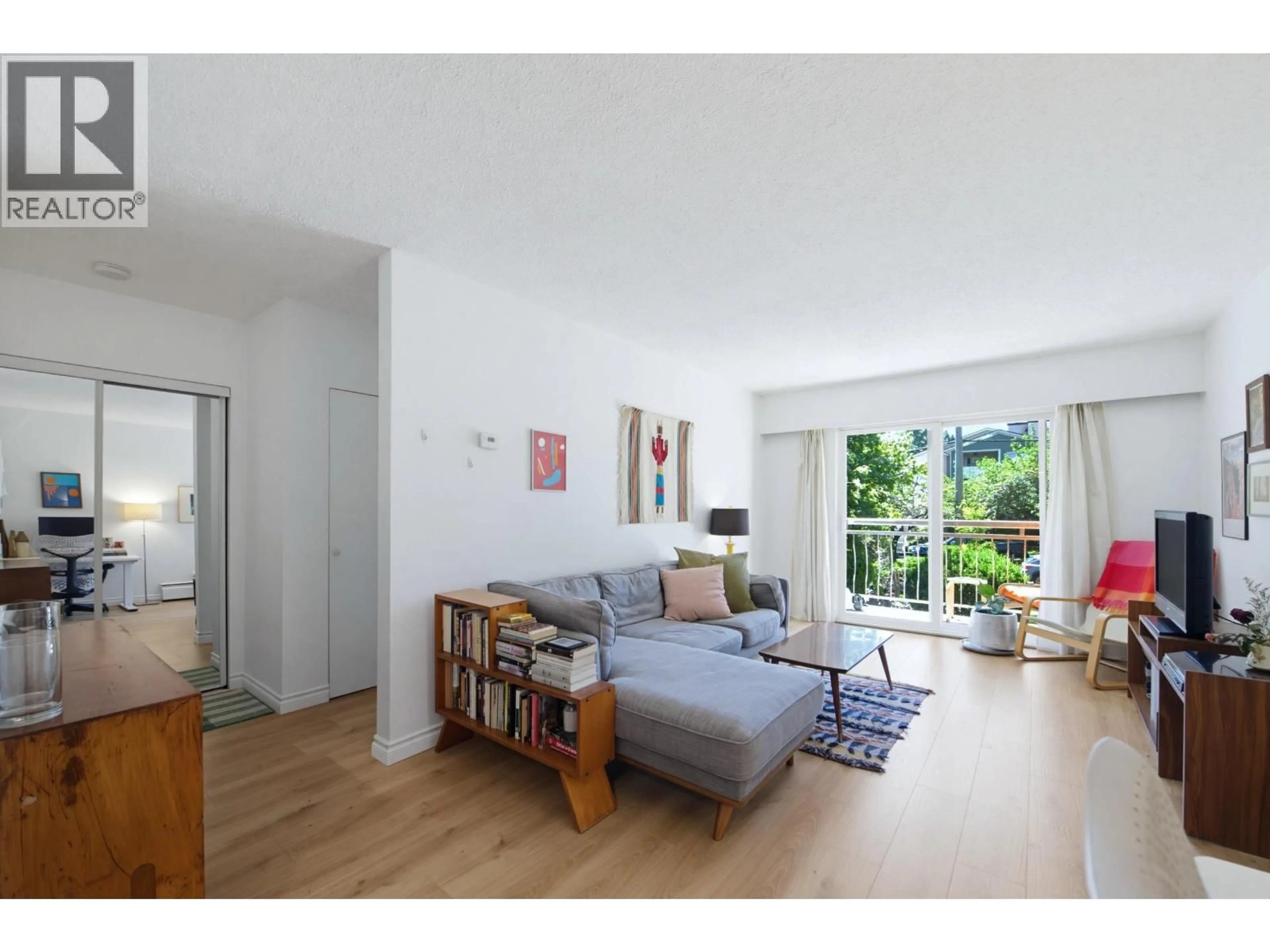 Living room with furniture, wood/laminate floor for 303 - 711 6TH AVENUE, Vancouver British Columbia V5T1L7