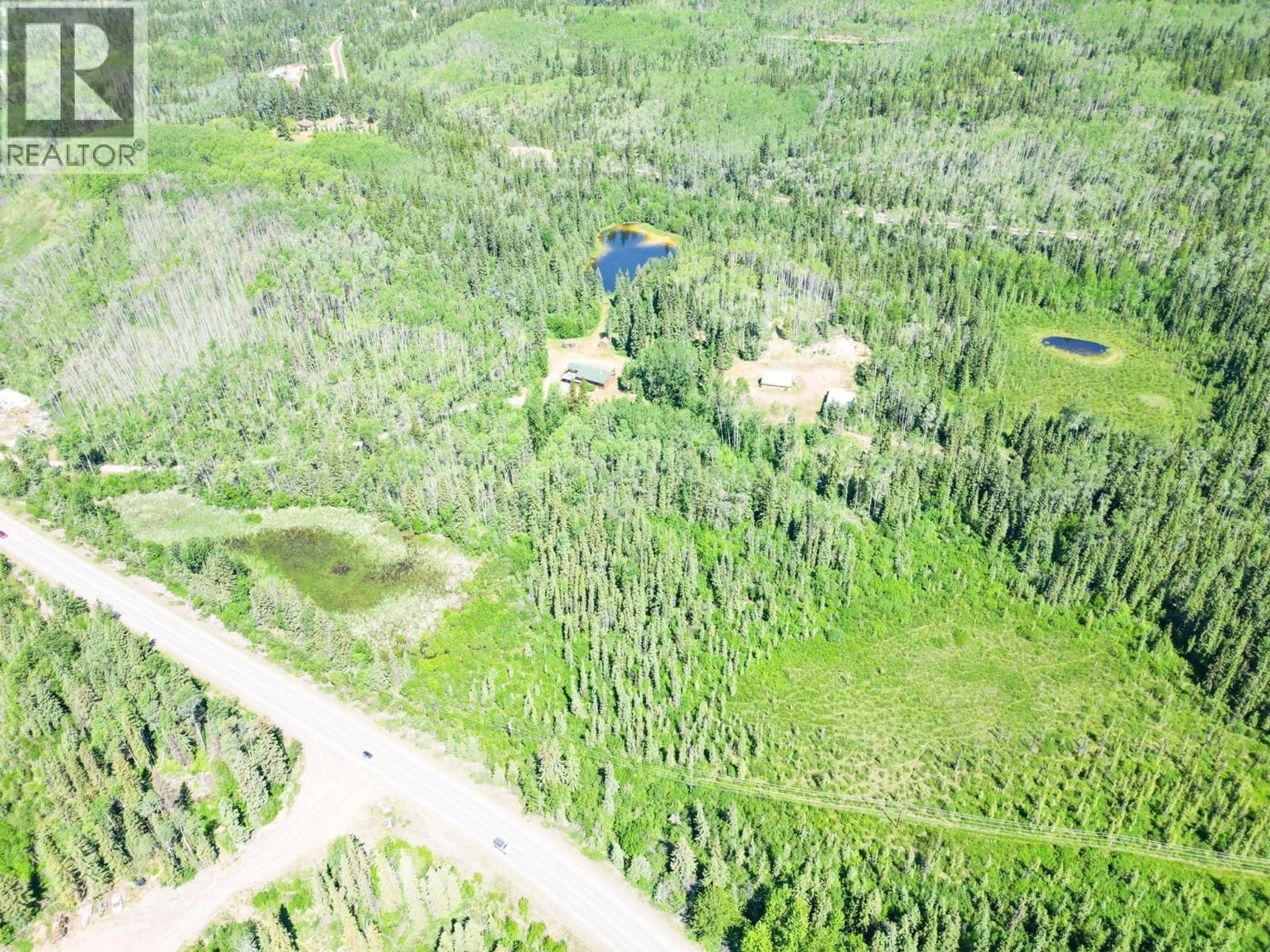 A pic from outside/outdoor area/front of a property/back of a property/a pic from drone, forest/trees view for 4100 16 HIGHWAY, Burns Lake British Columbia V0J1E3
