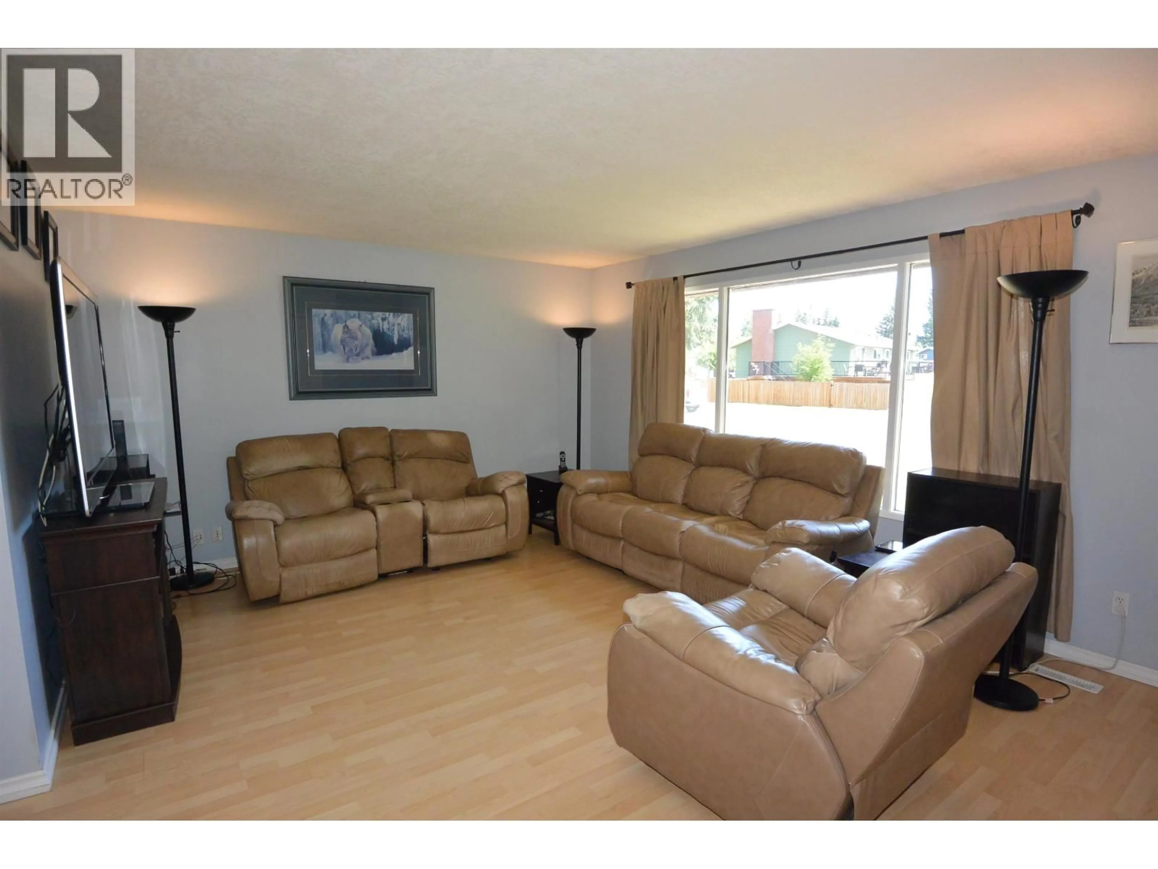 Living room with furniture, wood/laminate floor for 4131 7TH AVENUE, Smithers British Columbia V0J2N0