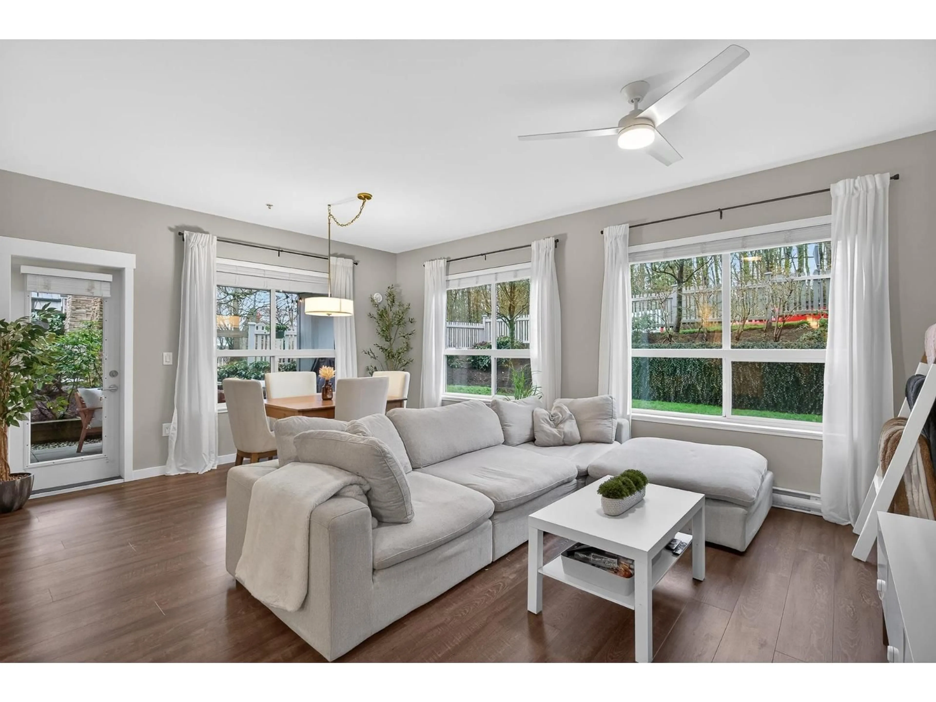 Living room with furniture, wood/laminate floor for B102 - 6490 194 STREET, Surrey British Columbia V4N6J9