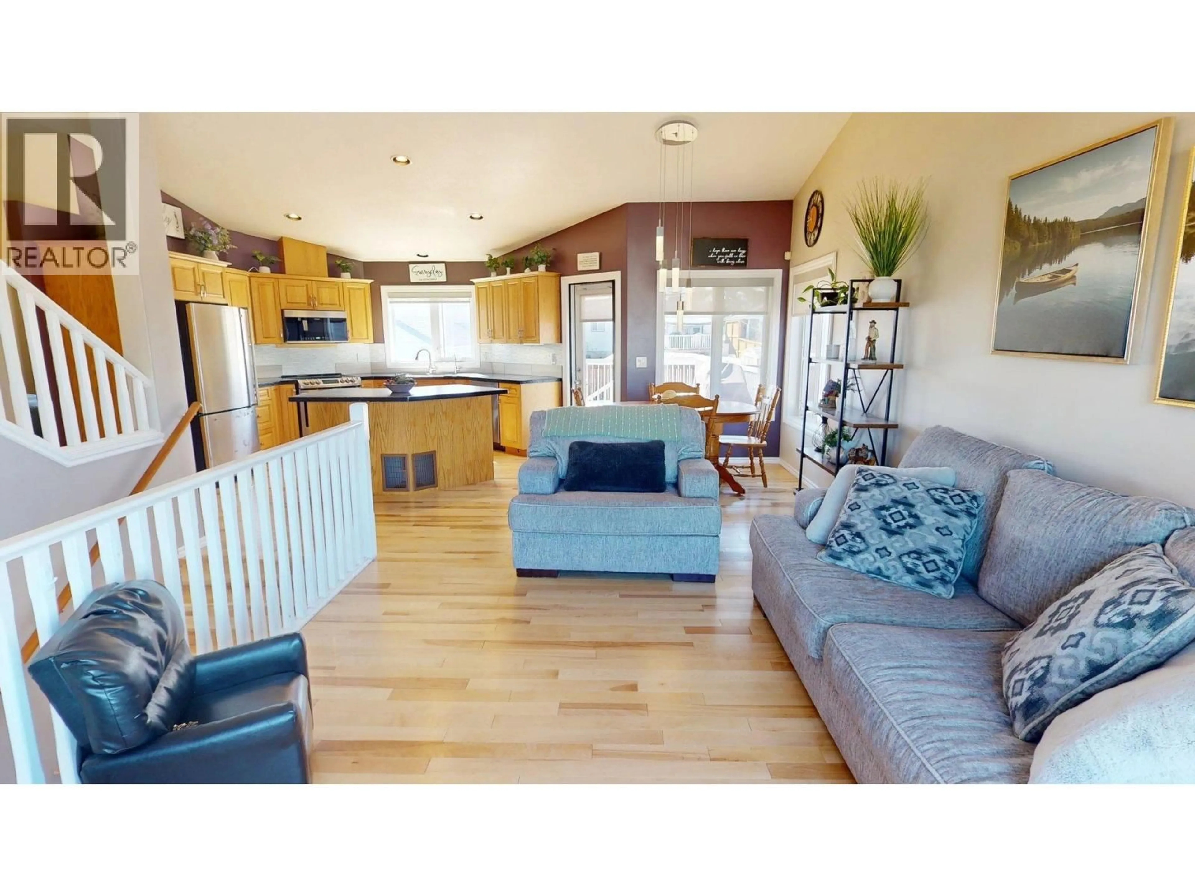 Open concept kitchen, wood/laminate floor for 9611 113 AVENUE, Fort St. John British Columbia V1J7J1