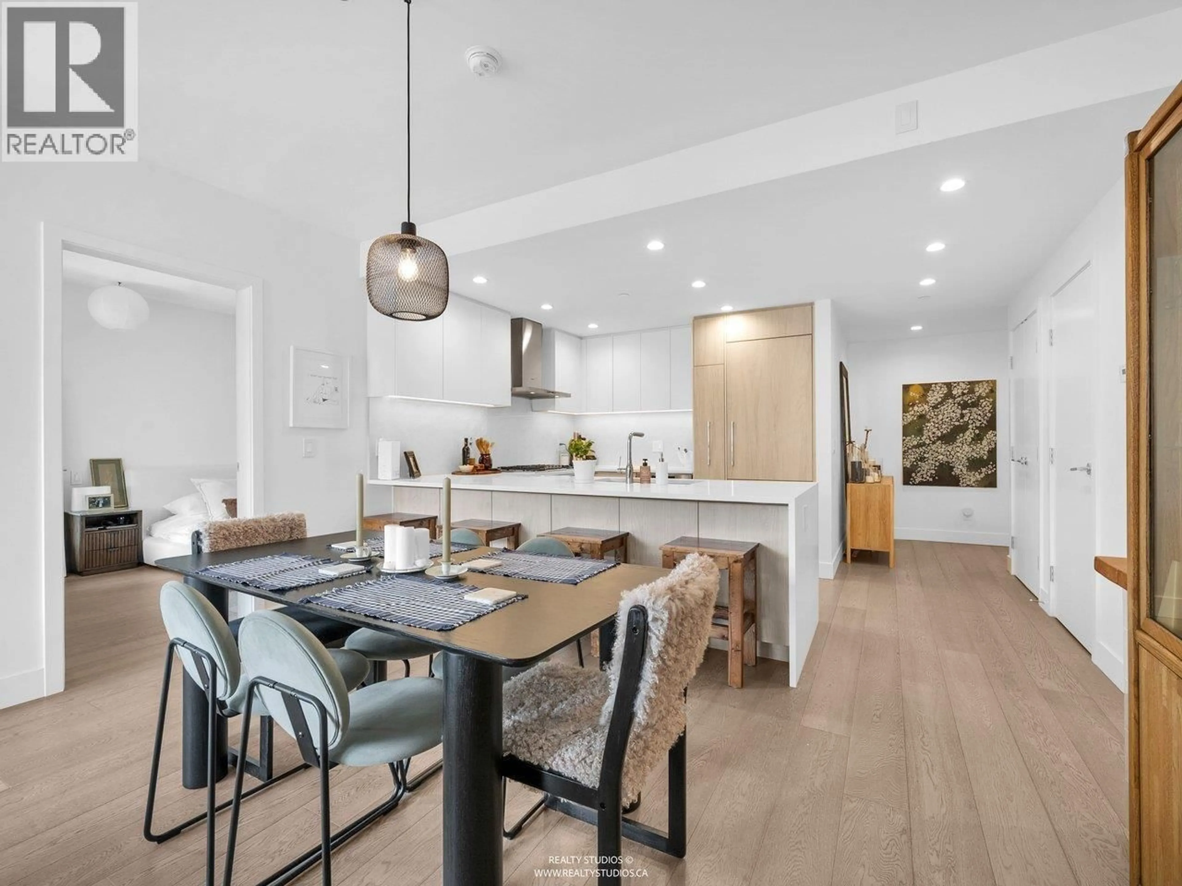 Open concept kitchen, wood/laminate floor for 503 - 177 3RD STREET, North Vancouver British Columbia V7M0G5