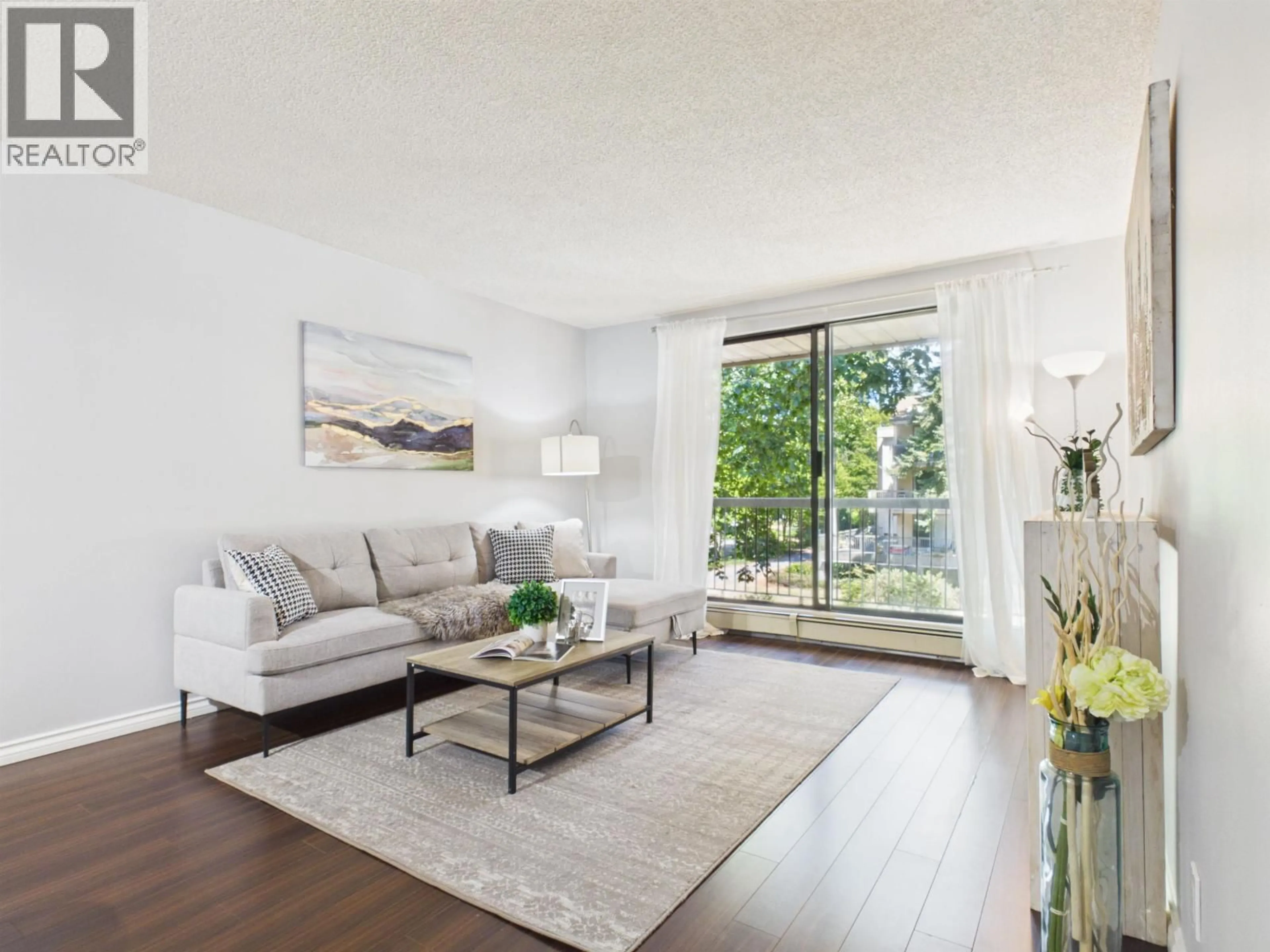 Living room with furniture, wood/laminate floor for 220 - 8411 ACKROYD, Richmond British Columbia V6X3E6