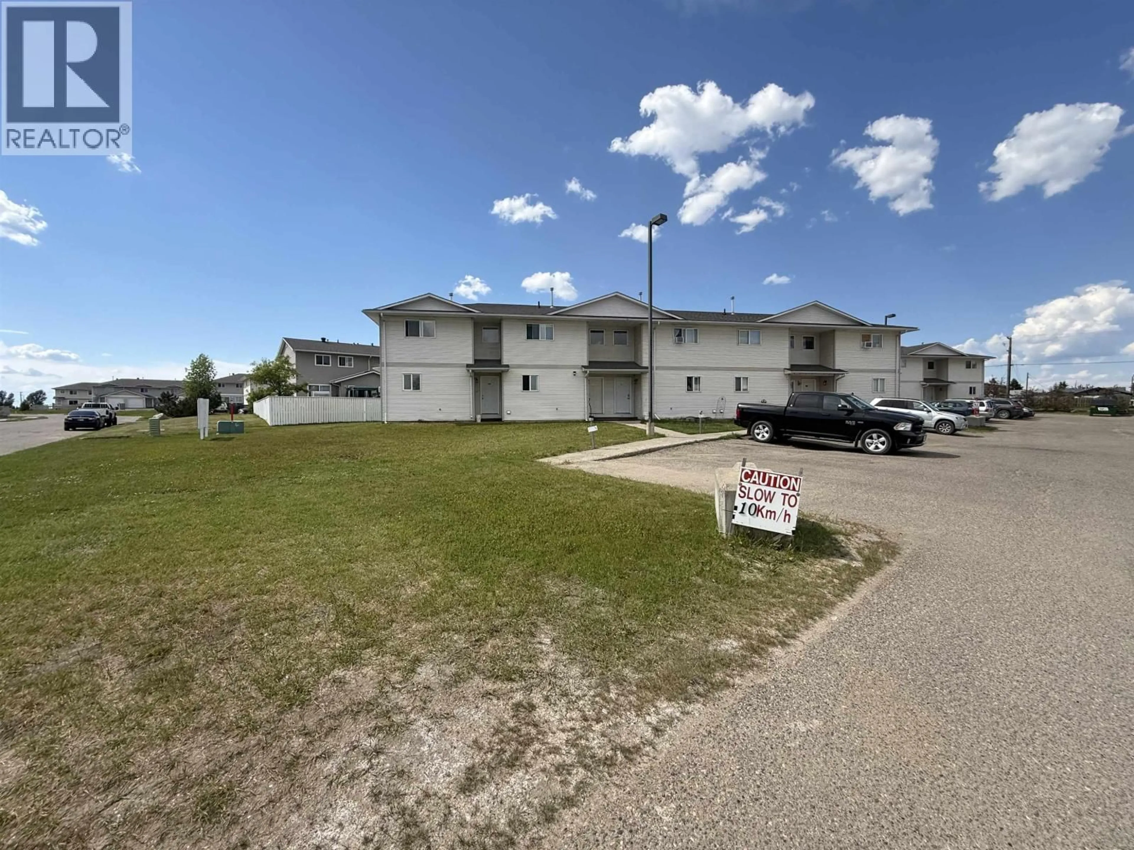 A pic from outside/outdoor area/front of a property/back of a property/a pic from drone, building for 403 - 8220 92 AVENUE, Fort St. John British Columbia V1J6X2