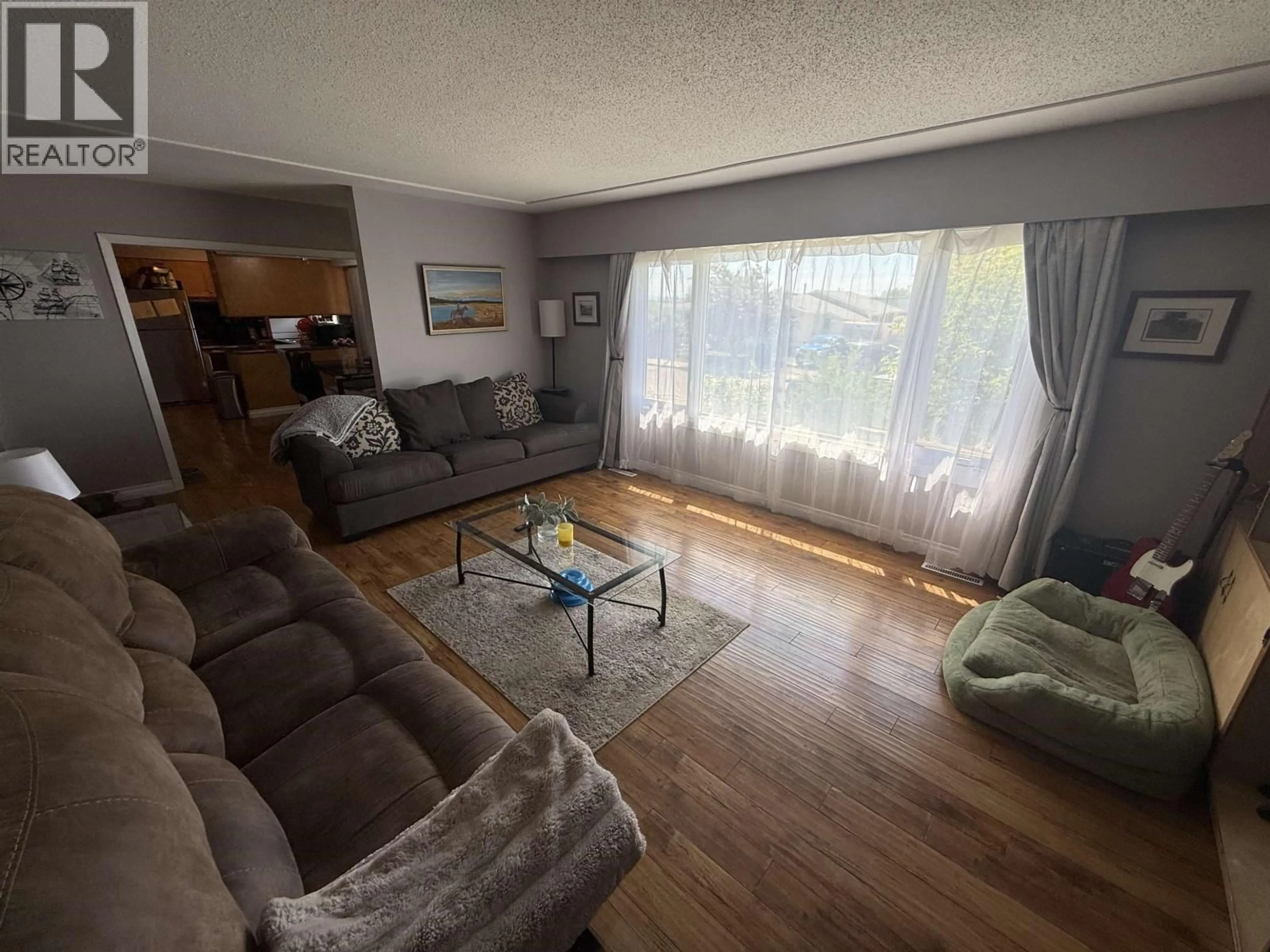 Living room with furniture, unknown for 10712 102 AVENUE, Fort St. John British Columbia V1J2E8