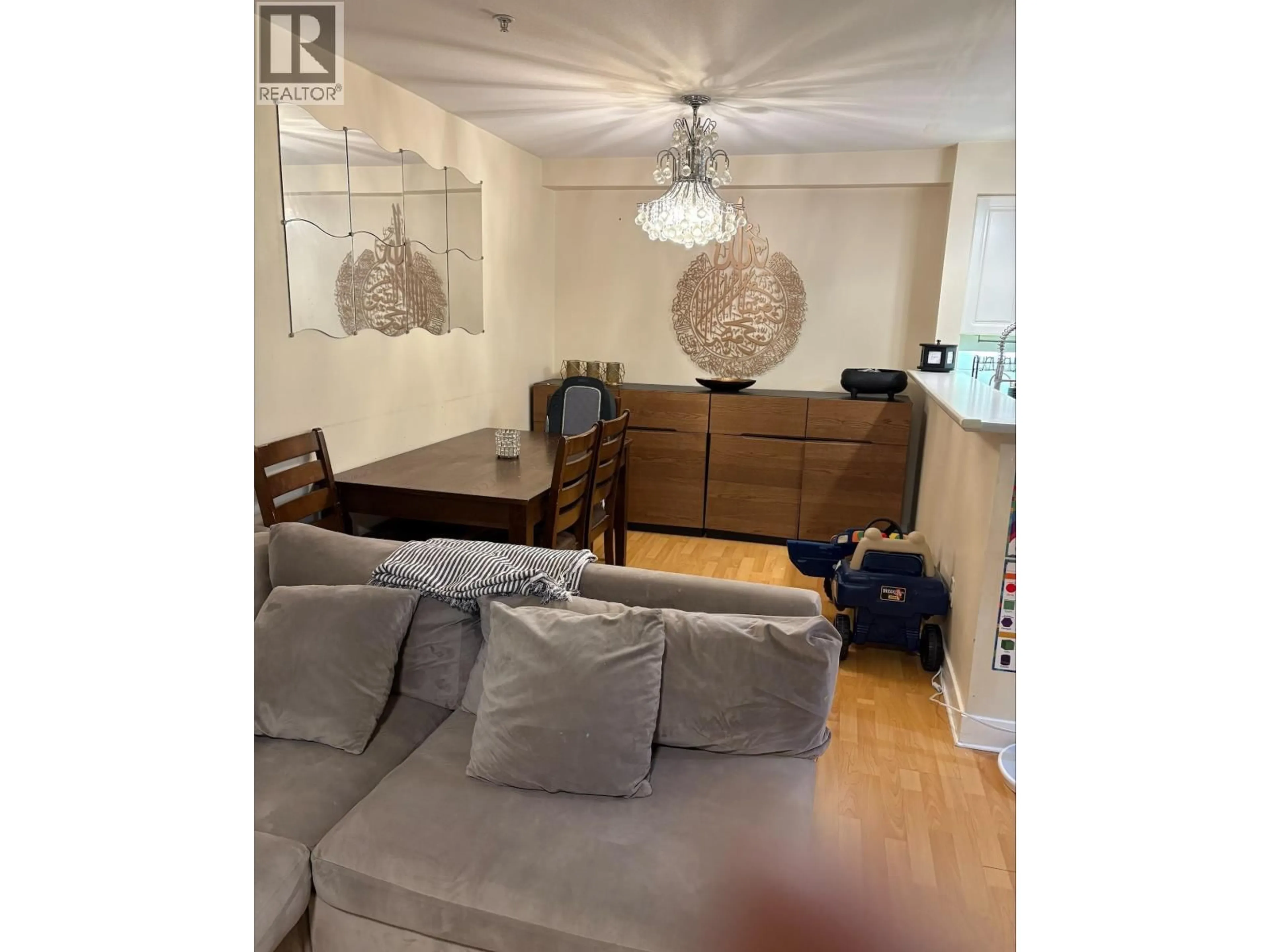 Living room with furniture, wood/laminate floor for 102 - 7038 21ST AVENUE, Burnaby British Columbia V5E2Y9