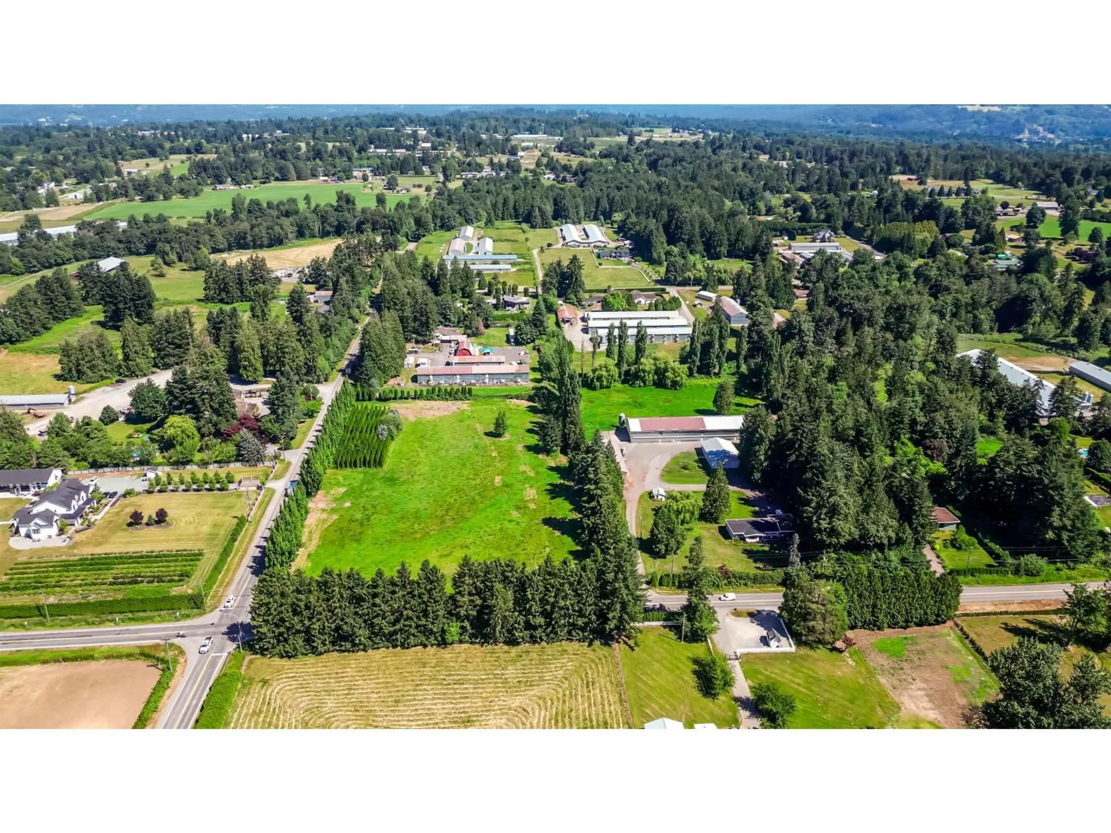 A pic from outside/outdoor area/front of a property/back of a property/a pic from drone, forest/trees view for 5950 BRADNER ROAD, Abbotsford British Columbia V4X2C7