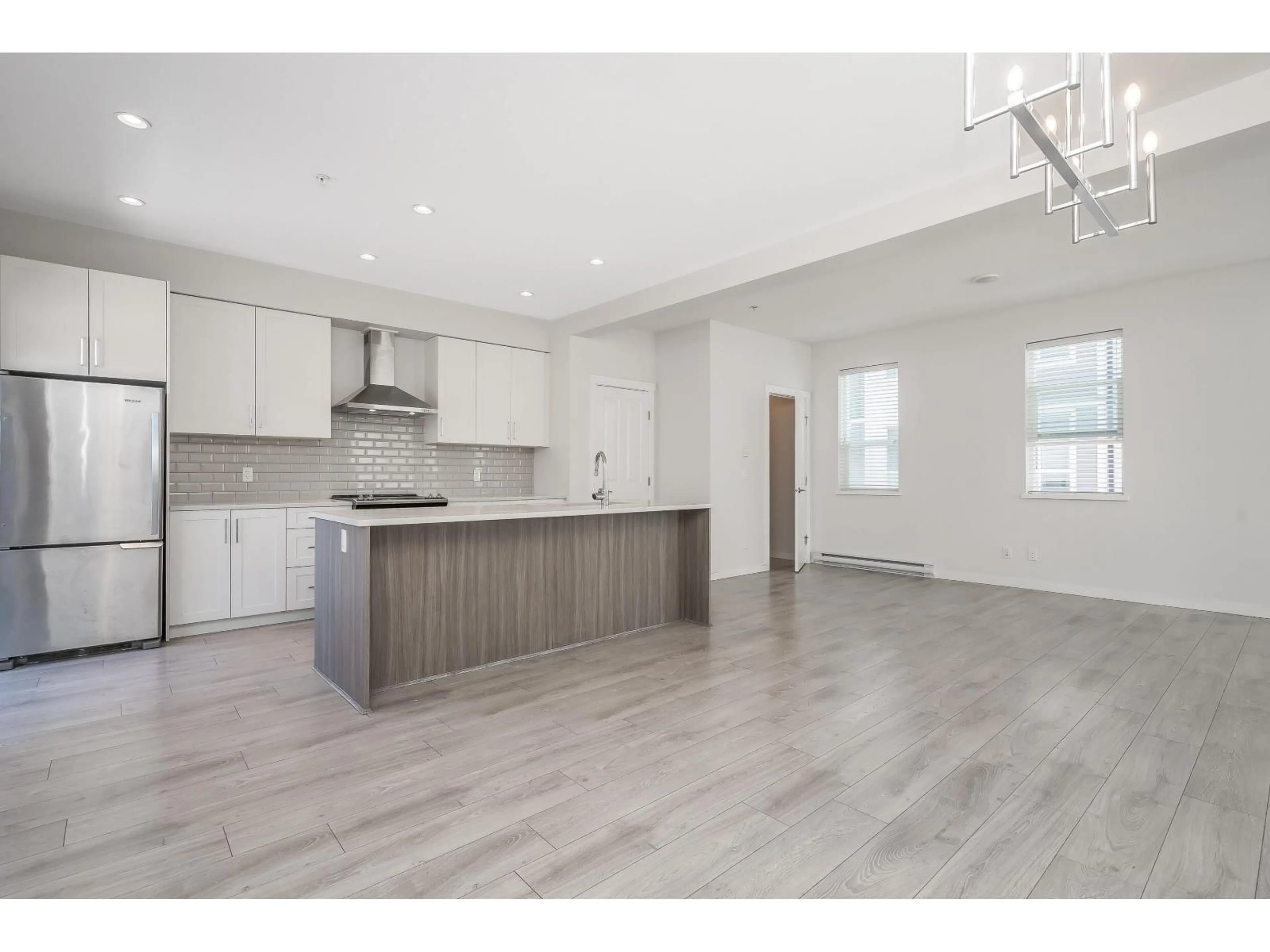 Open concept kitchen, wood/laminate floor for 1 - 20723 FRASER HIGHWAY, Langley British Columbia V3A0K2