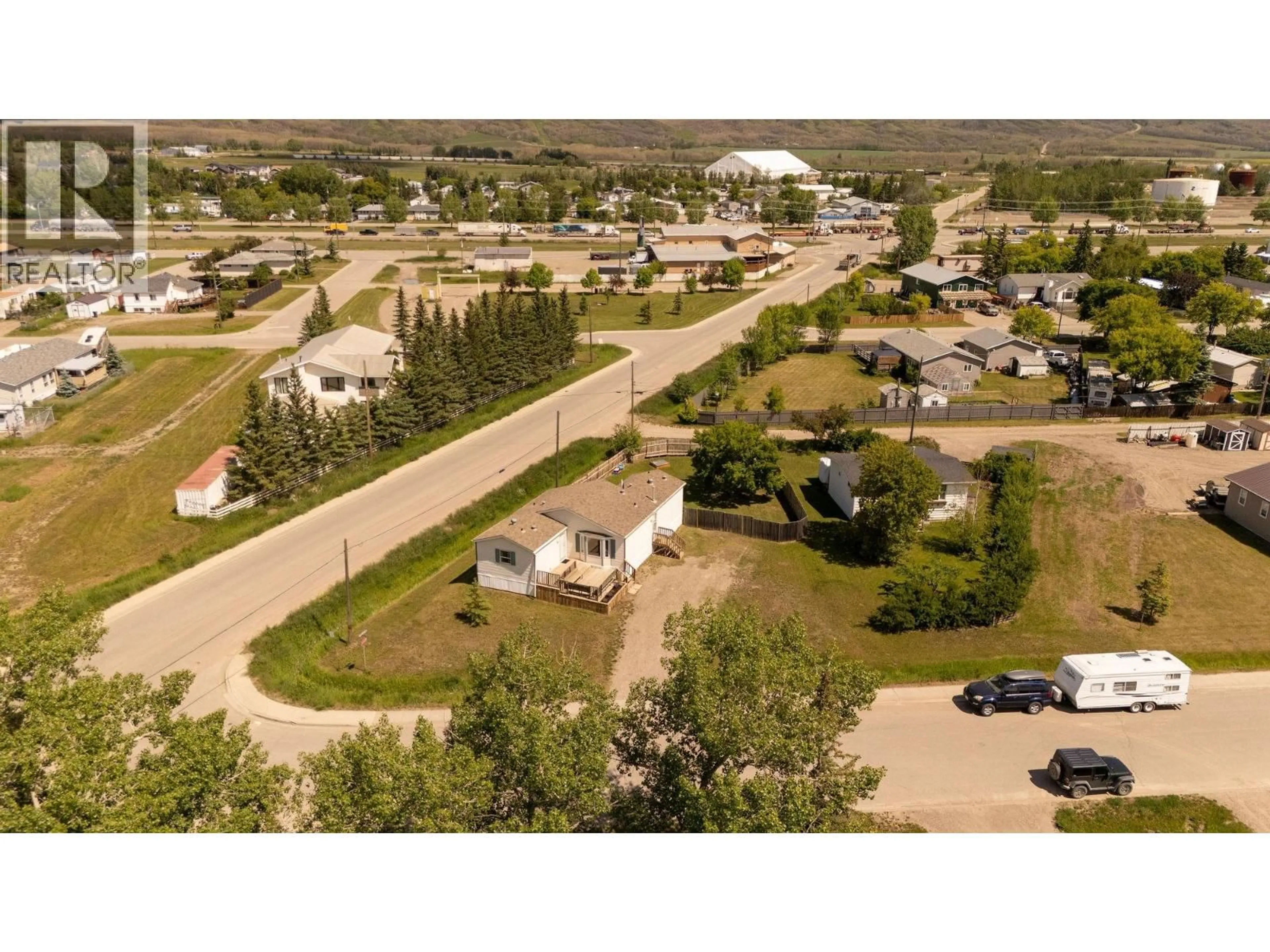 A pic from outside/outdoor area/front of a property/back of a property/a pic from drone, street for 10439 102 STREET, Taylor British Columbia V0C2K0