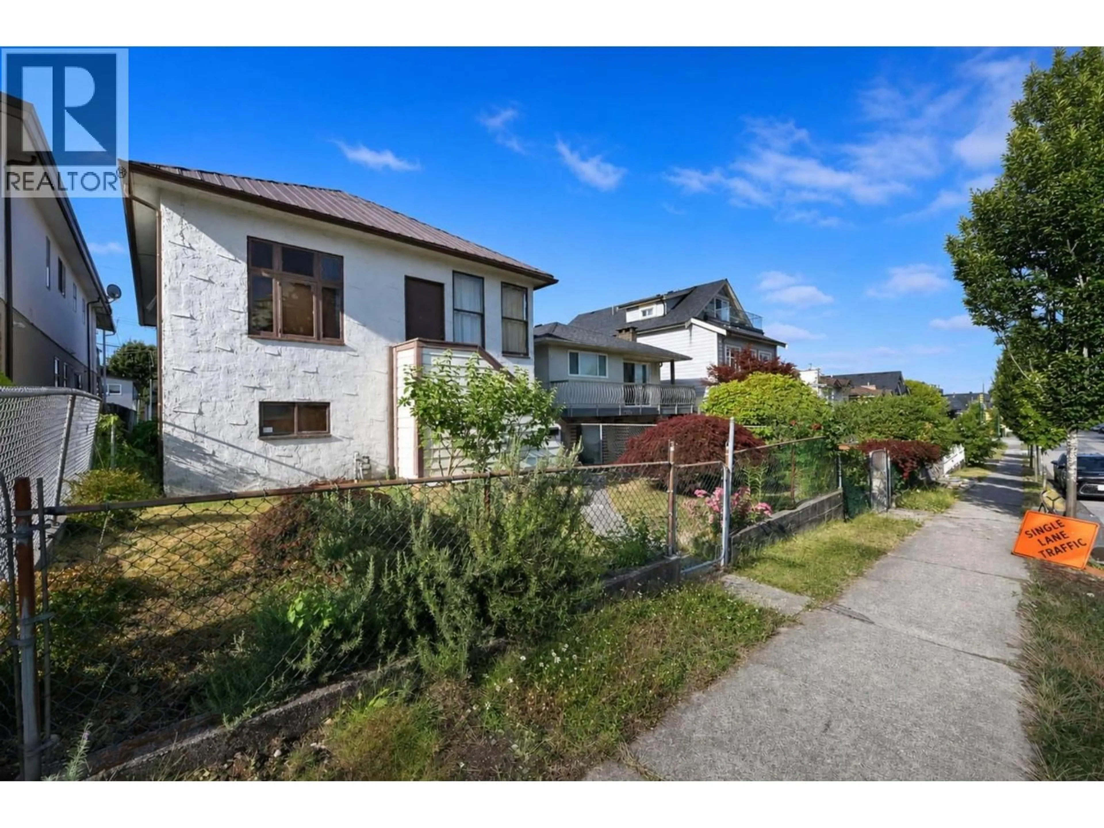 A pic from outside/outdoor area/front of a property/back of a property/a pic from drone, street for 2354 33RD AVENUE, Vancouver British Columbia V5R2S3