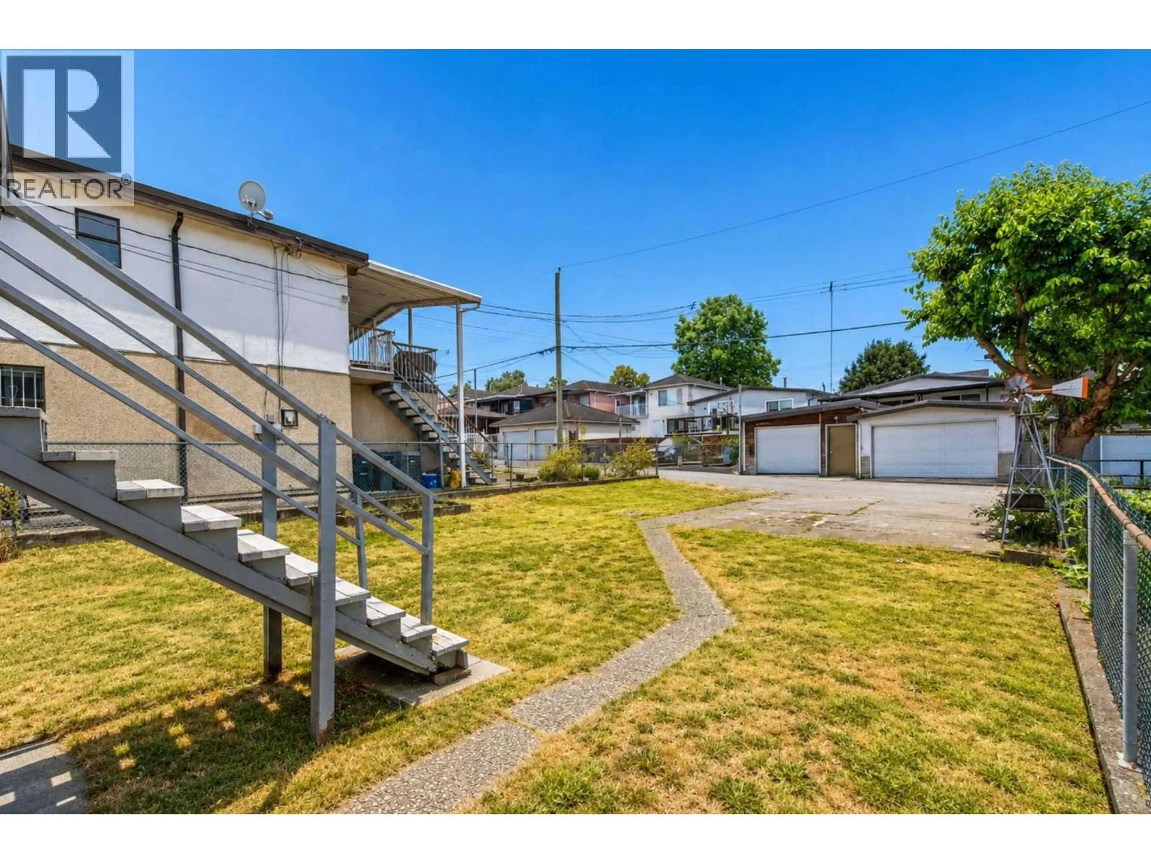 A pic from outside/outdoor area/front of a property/back of a property/a pic from drone, street for 2354 33RD AVENUE, Vancouver British Columbia V5R2S3