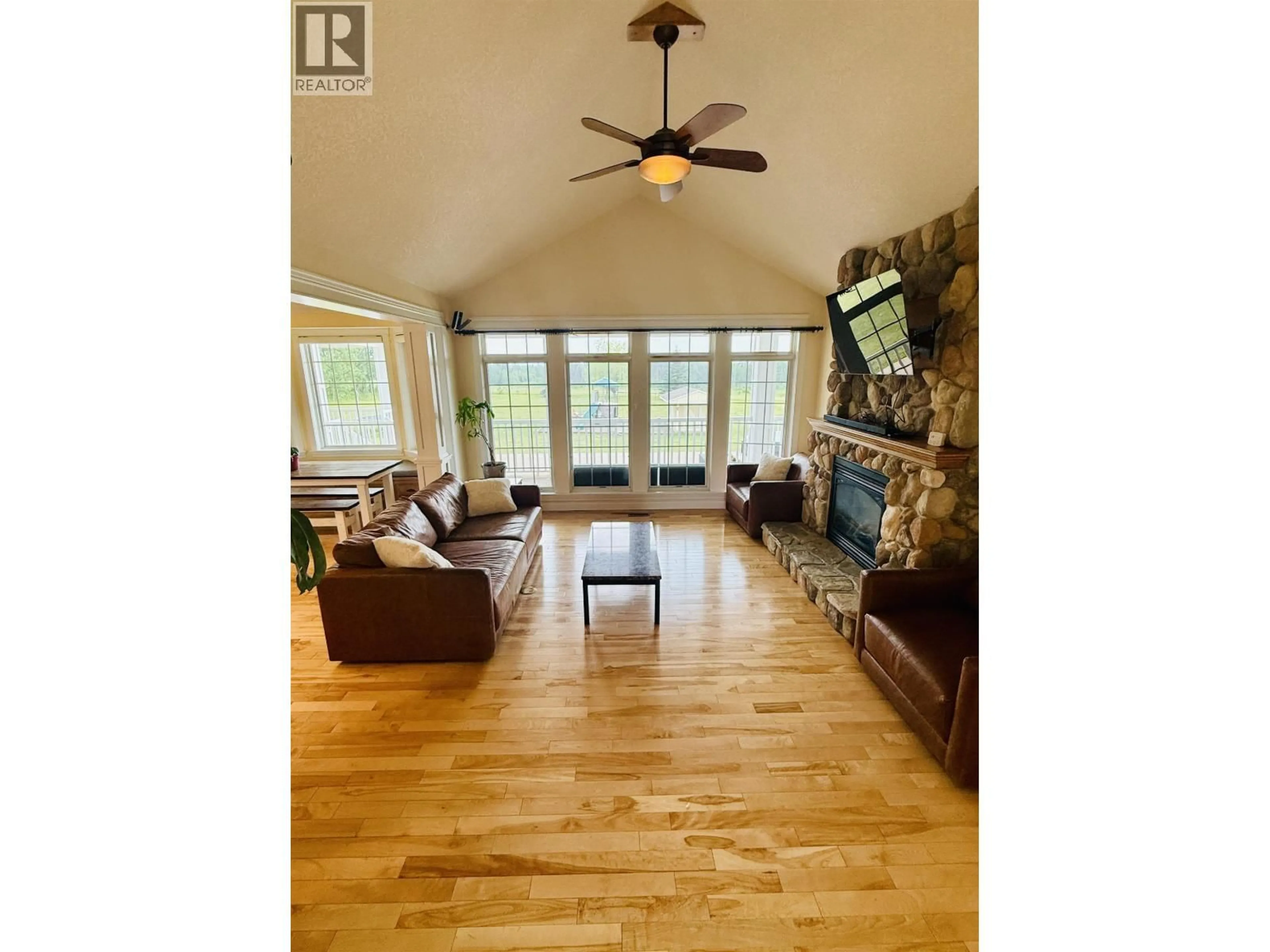 Living room with furniture, wood/laminate floor for 12201 PACIFIC AVENUE, Fort St. John British Columbia V1J8A5
