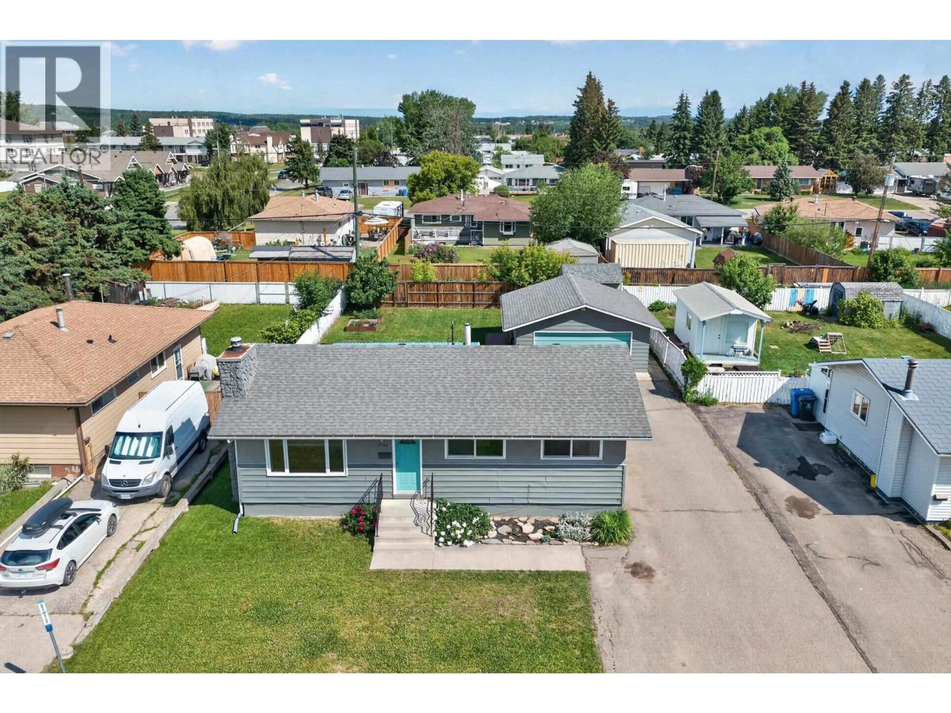 A pic from outside/outdoor area/front of a property/back of a property/a pic from drone, street for 9720 105 AVENUE, Fort St. John British Columbia V1J2M1