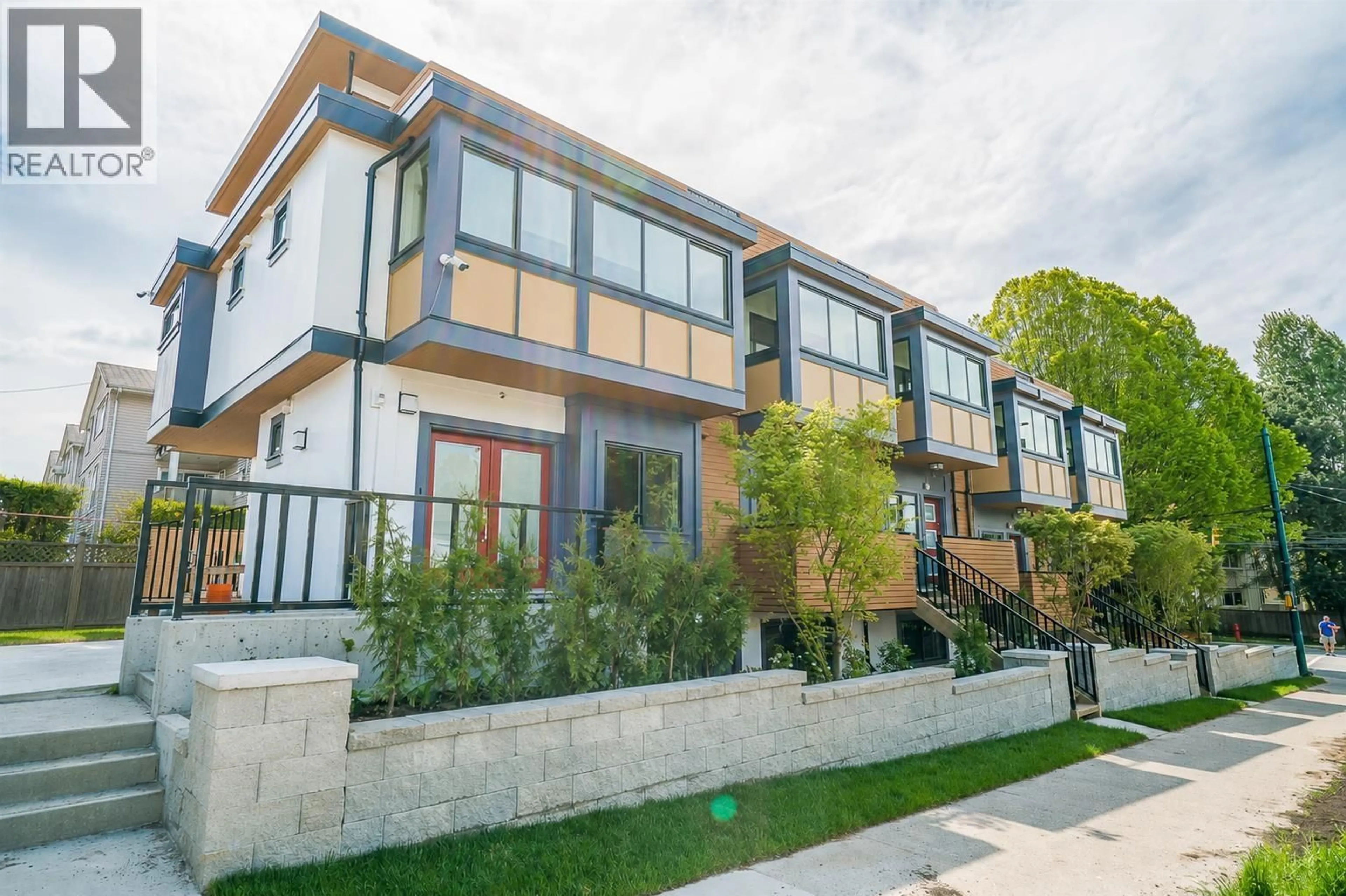 Home with brick exterior material, street for 2412 DUNDAS STREET, Vancouver British Columbia V5K1P6