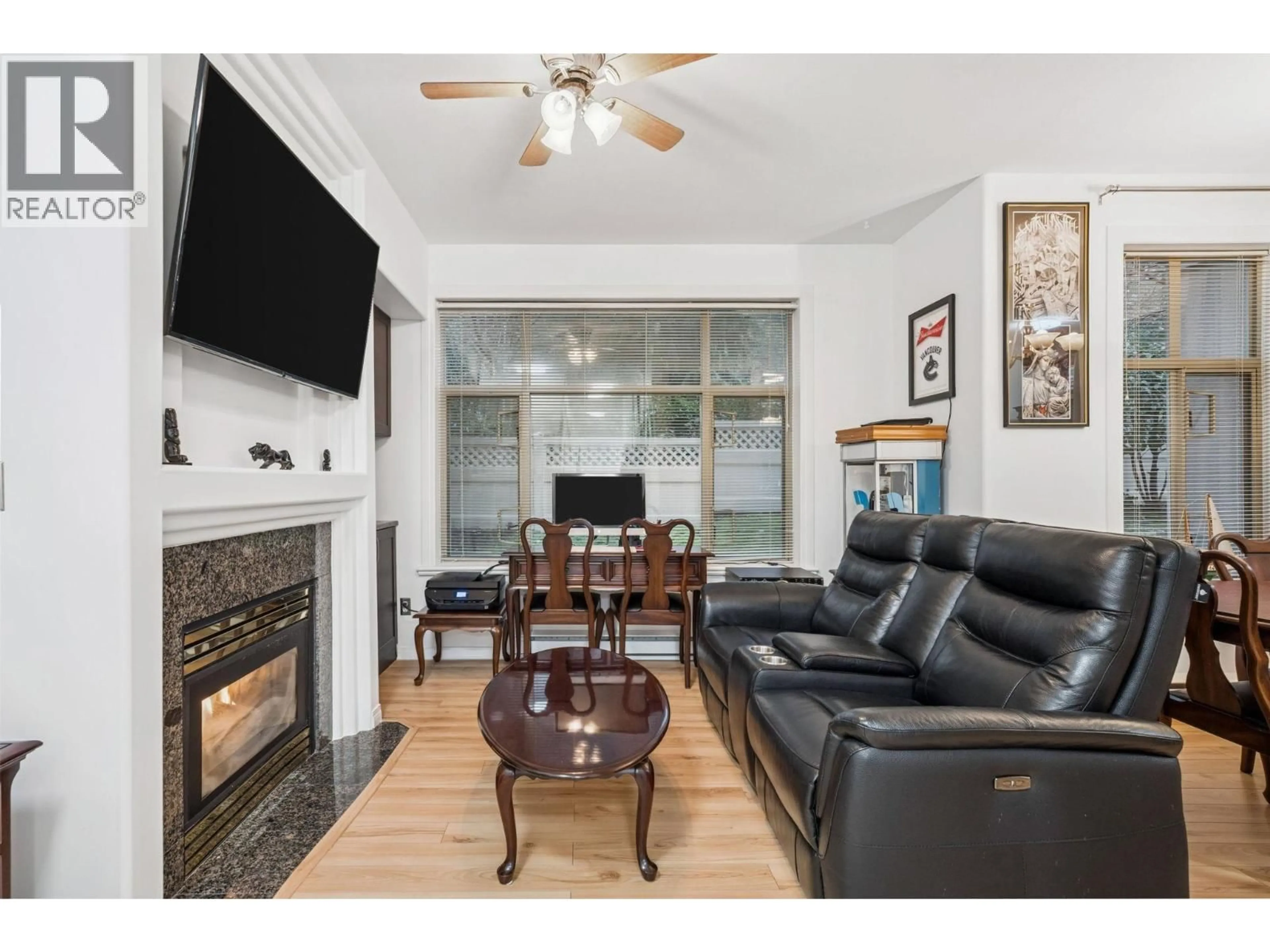 Living room with furniture, wood/laminate floor for 208 - 3176 PLATEAU BOULEVARD, Coquitlam British Columbia V3E3J2