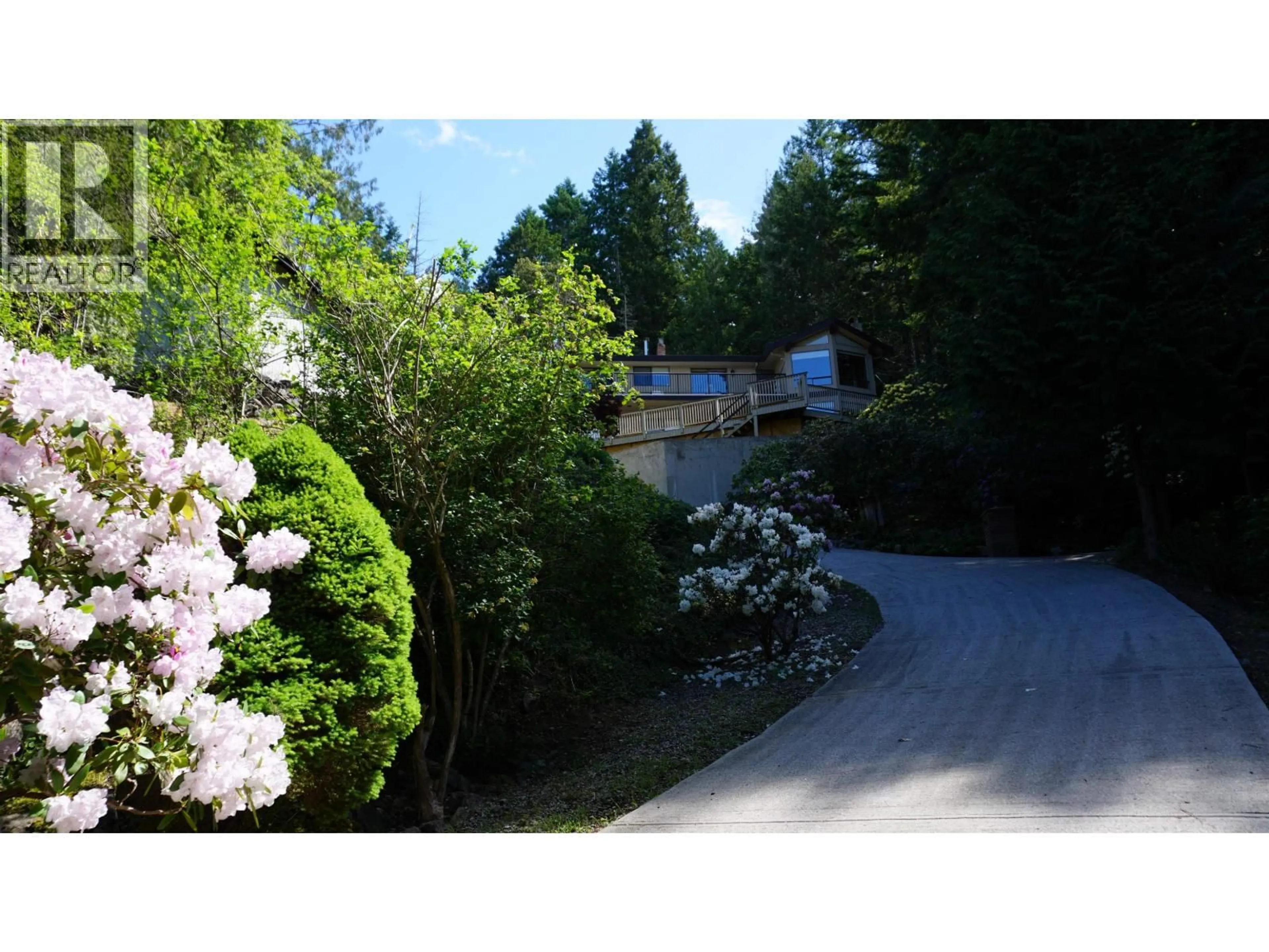 A pic from outside/outdoor area/front of a property/back of a property/a pic from drone, street for 8846 REDROOFFS ROAD, Halfmoon Bay British Columbia V7Z1B2