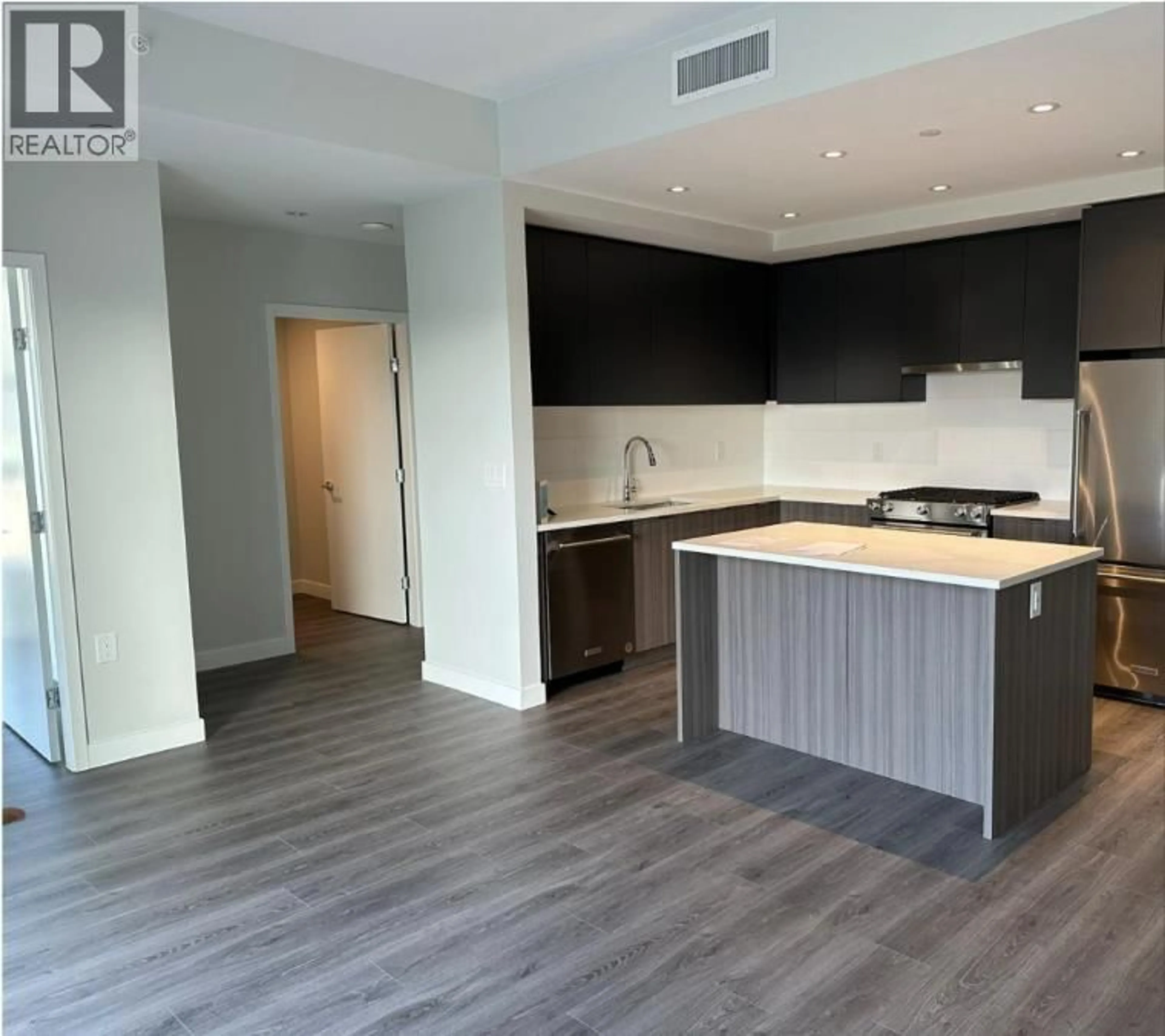 Open concept kitchen, wood/laminate floor for 211 - 3430 KENT AVENUE SOUTH, Vancouver British Columbia V5S0G7