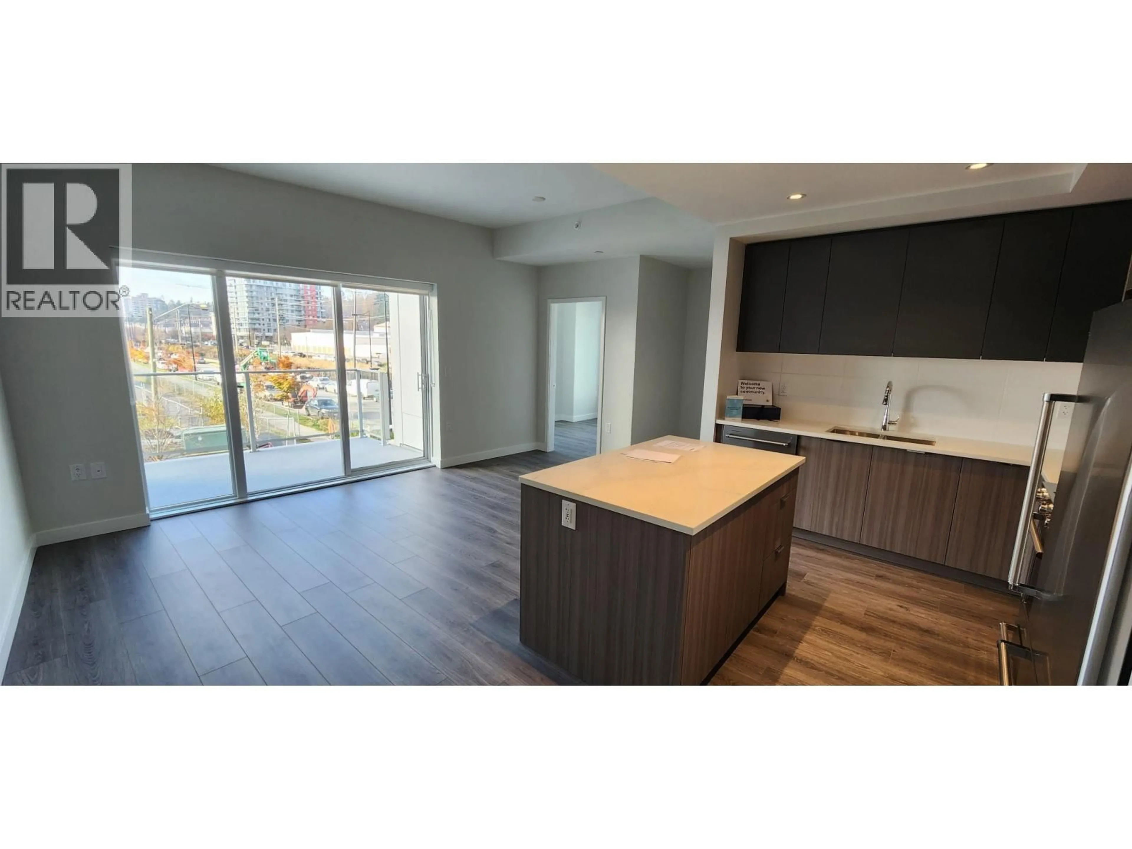 Open concept kitchen, wood/laminate floor for 211 - 3430 KENT AVENUE SOUTH, Vancouver British Columbia V5S0G7