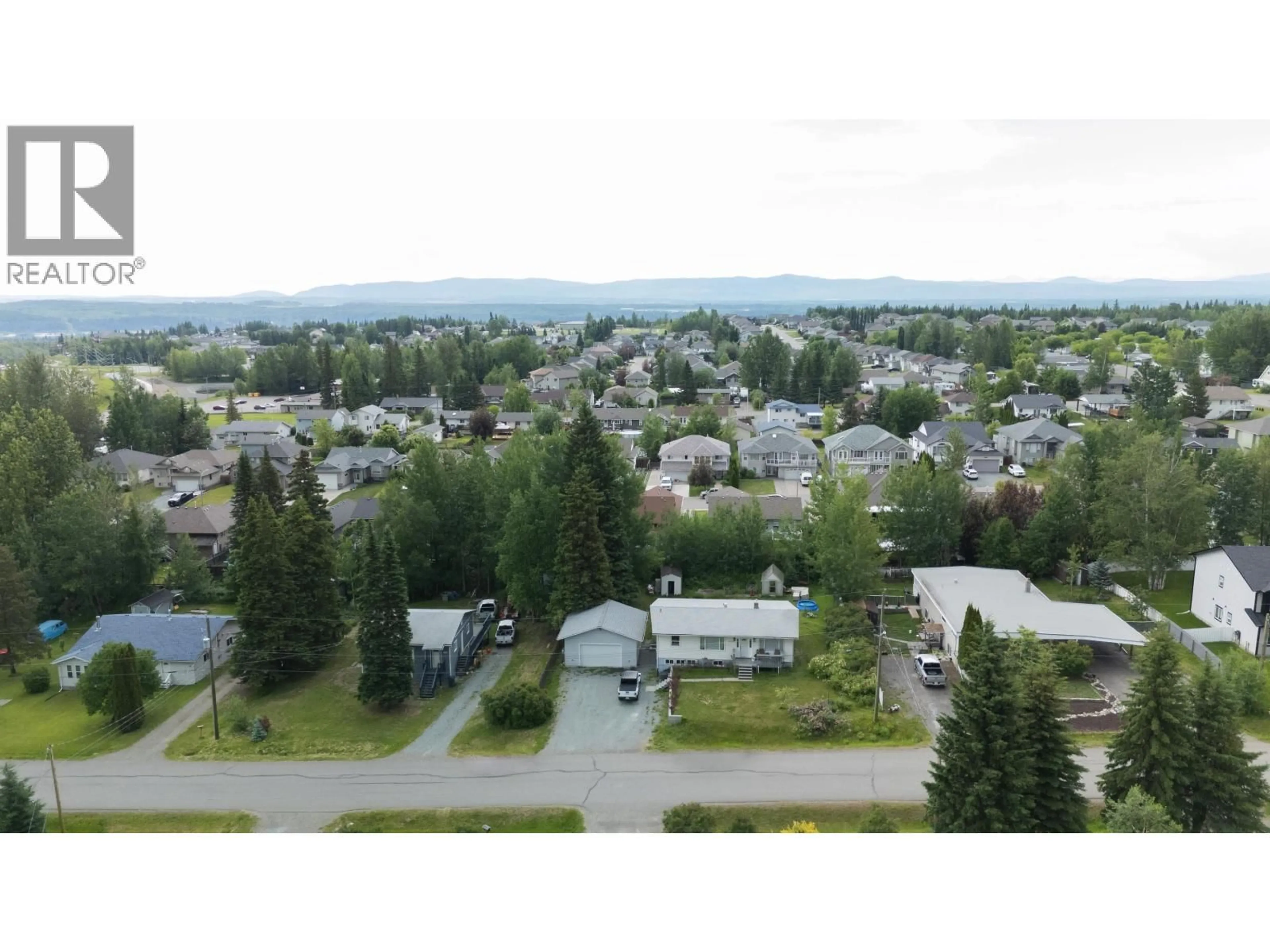 A pic from outside/outdoor area/front of a property/back of a property/a pic from drone, mountain view for 6986 TONY ROAD, Prince George British Columbia V2N5P4
