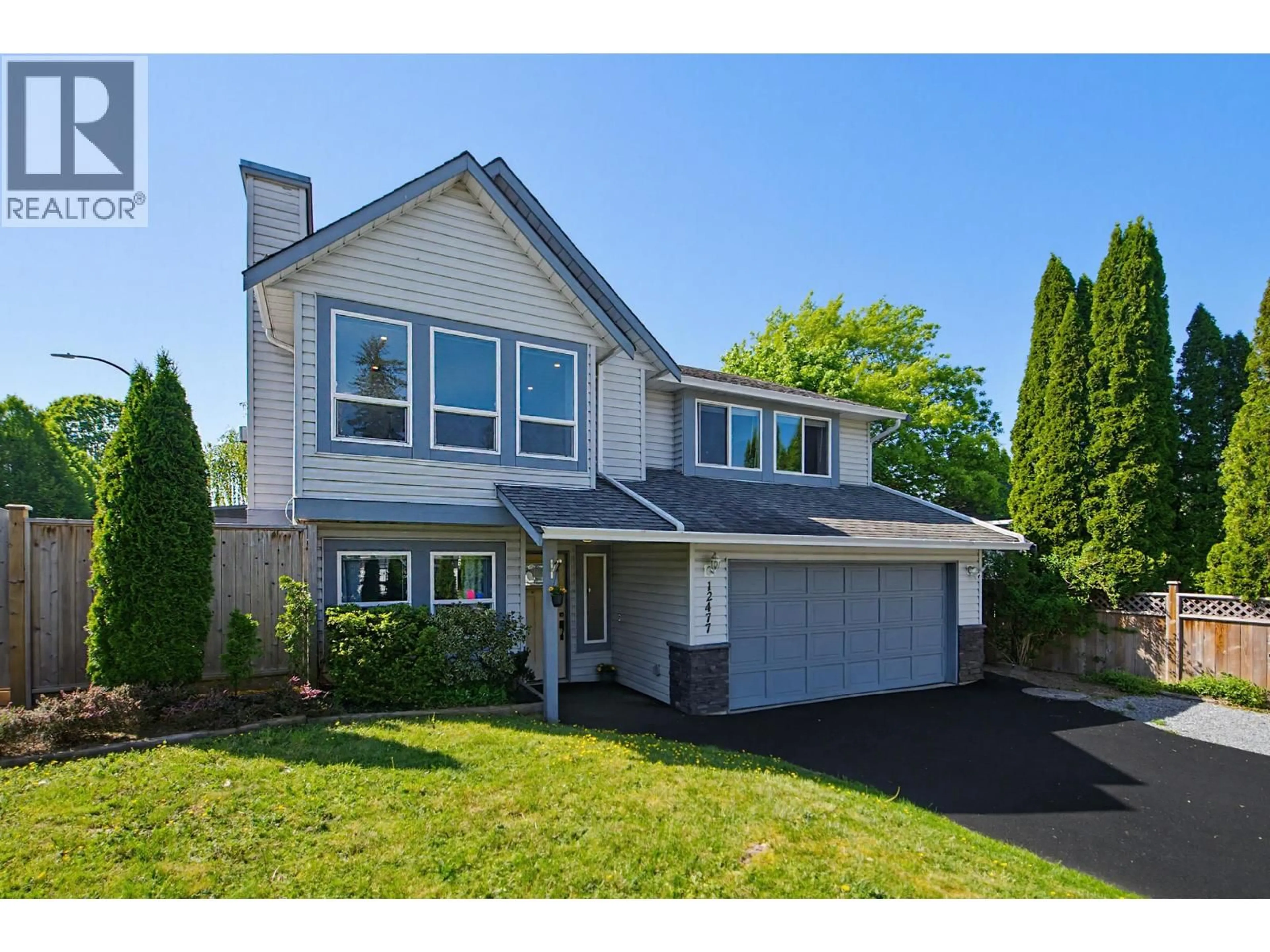 Home with vinyl exterior material, street for 12477 230 STREET, Maple Ridge British Columbia V2X0X2