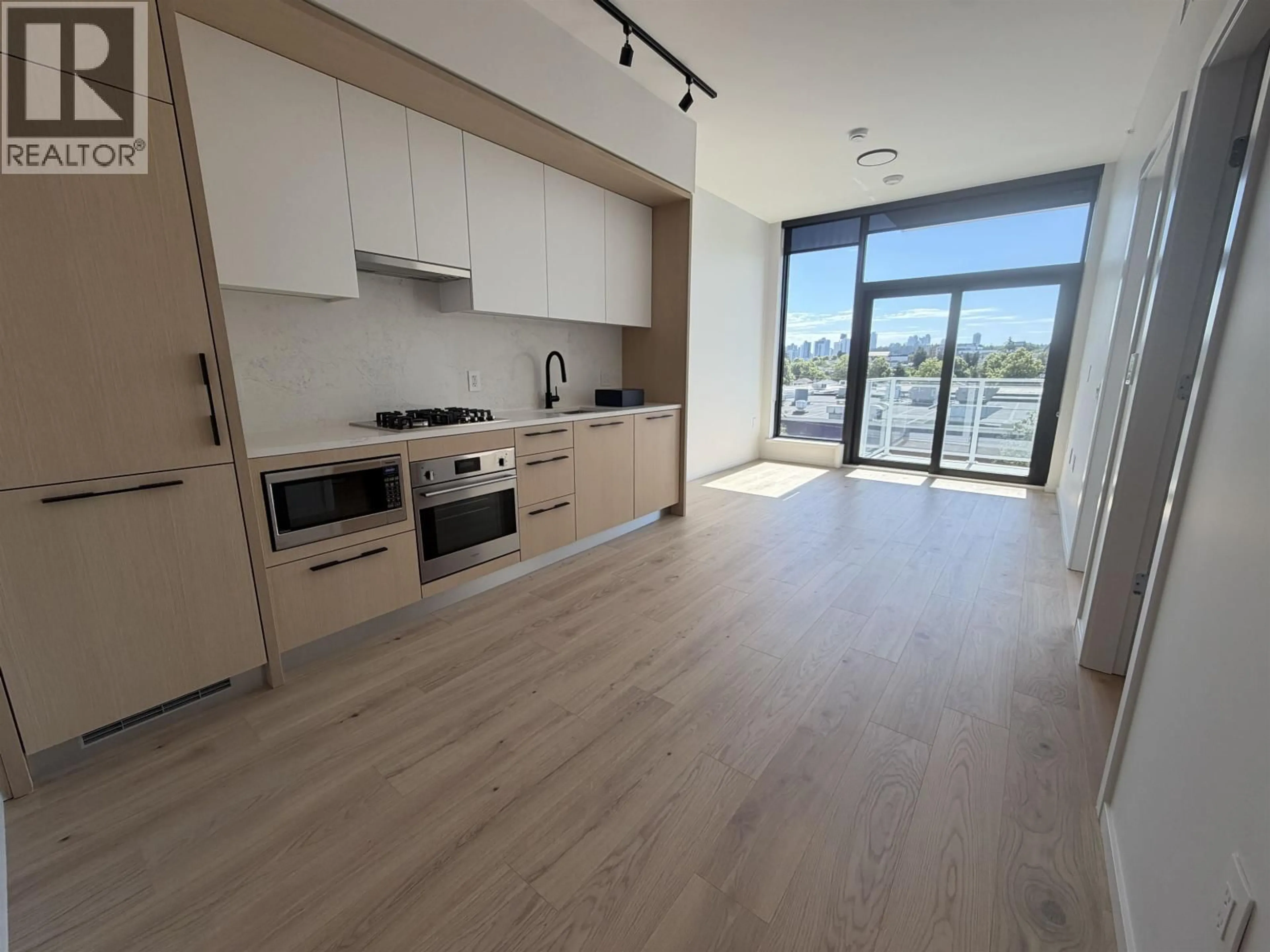 Open concept kitchen, wood/laminate floor for 462 - 5189 EARLES STREET, Vancouver British Columbia V5R5H4
