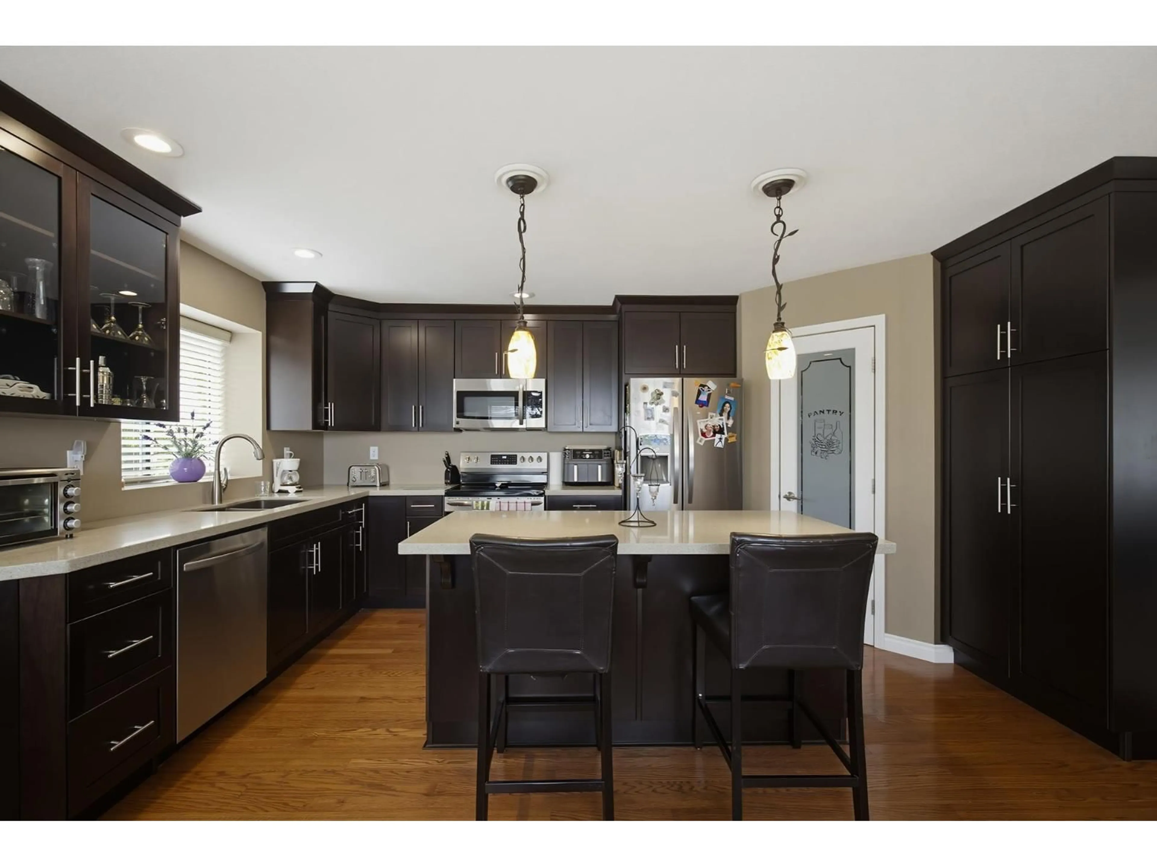 Open concept kitchen, wood/laminate floor for 8219 FUJINO STREET, Mission British Columbia V2V6T6