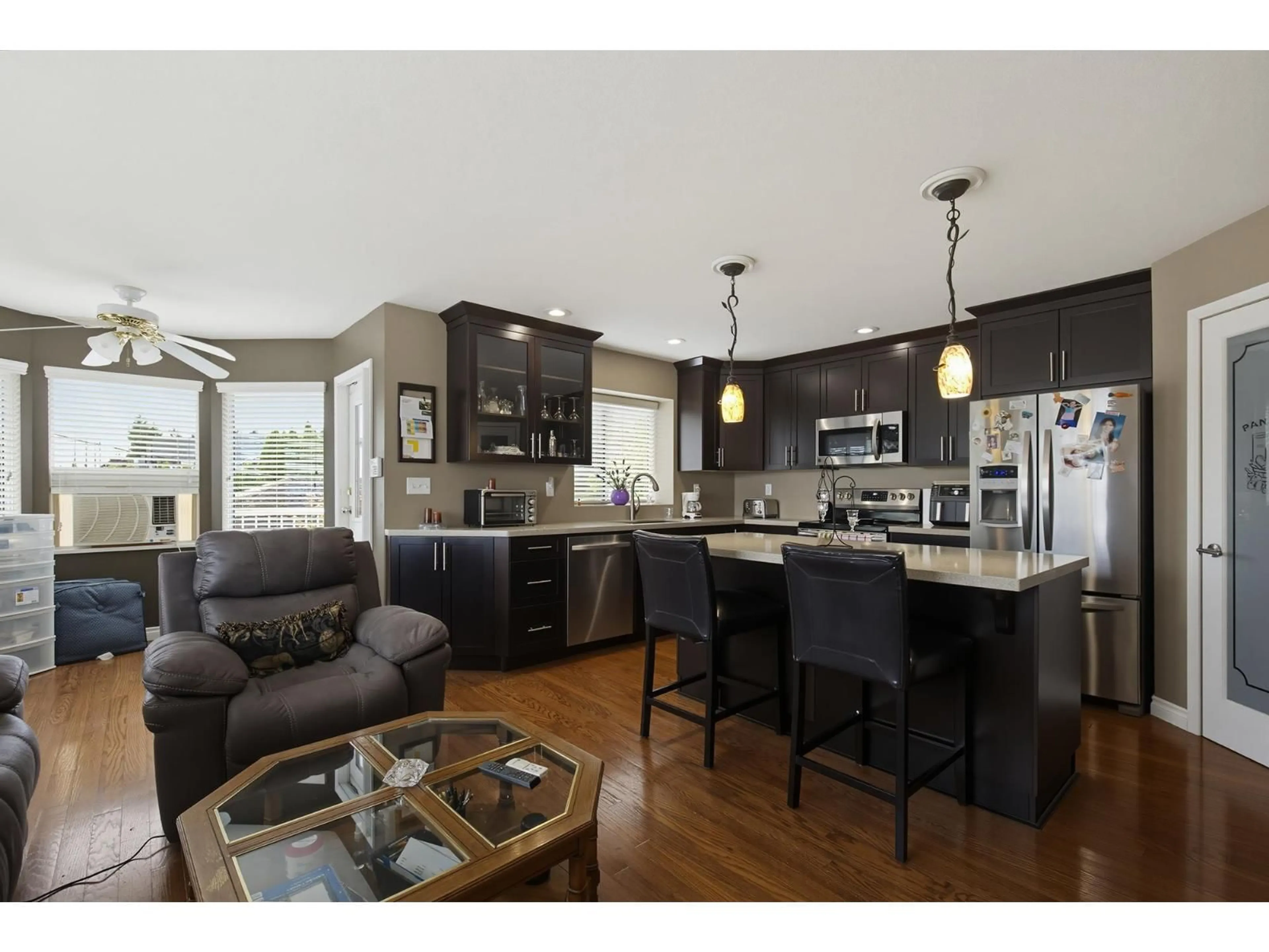 Open concept kitchen, wood/laminate floor for 8219 FUJINO STREET, Mission British Columbia V2V6T6