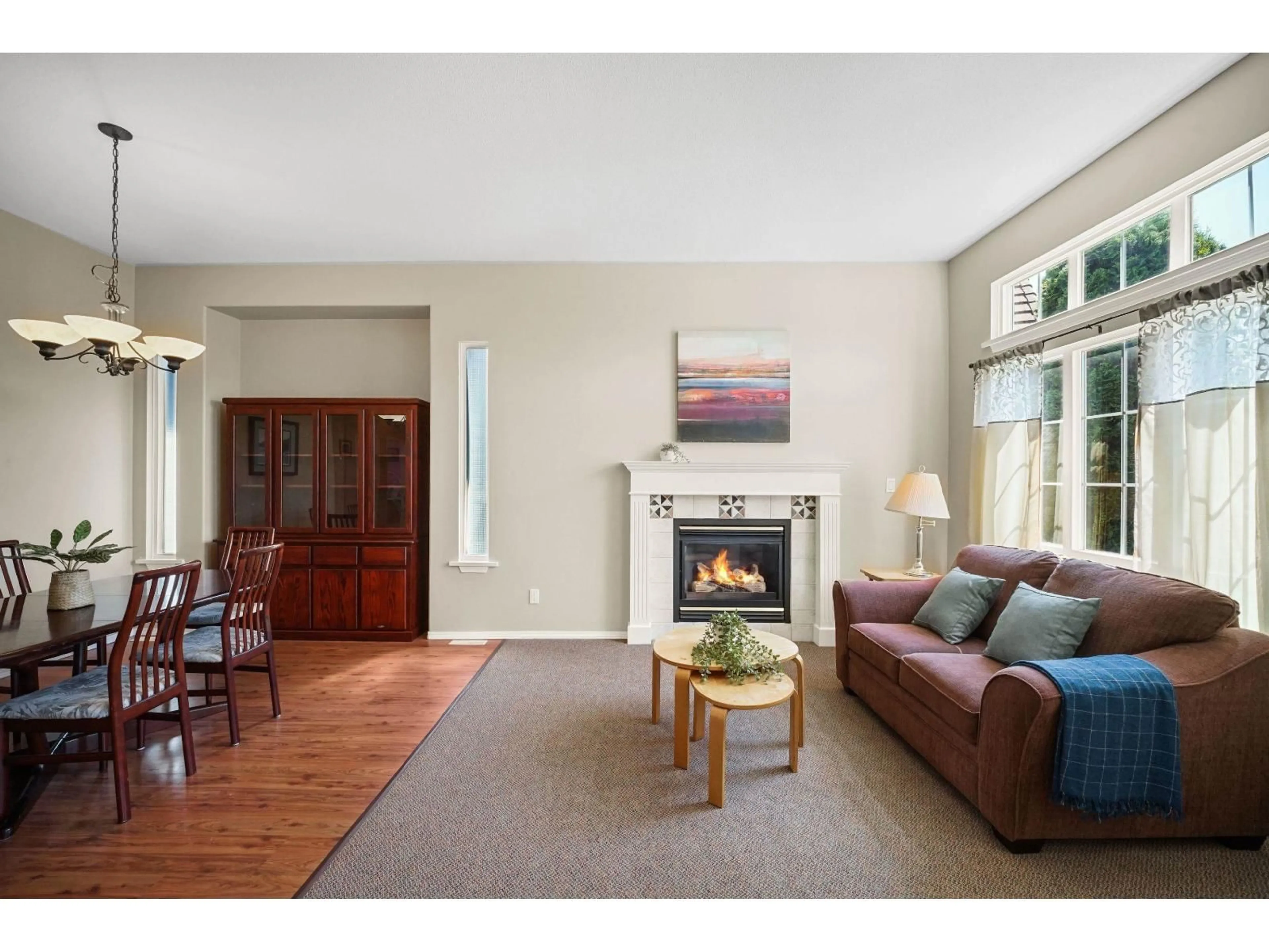Living room with furniture, wood/laminate floor for 18361 66 AVENUE, Surrey British Columbia V3S9A1