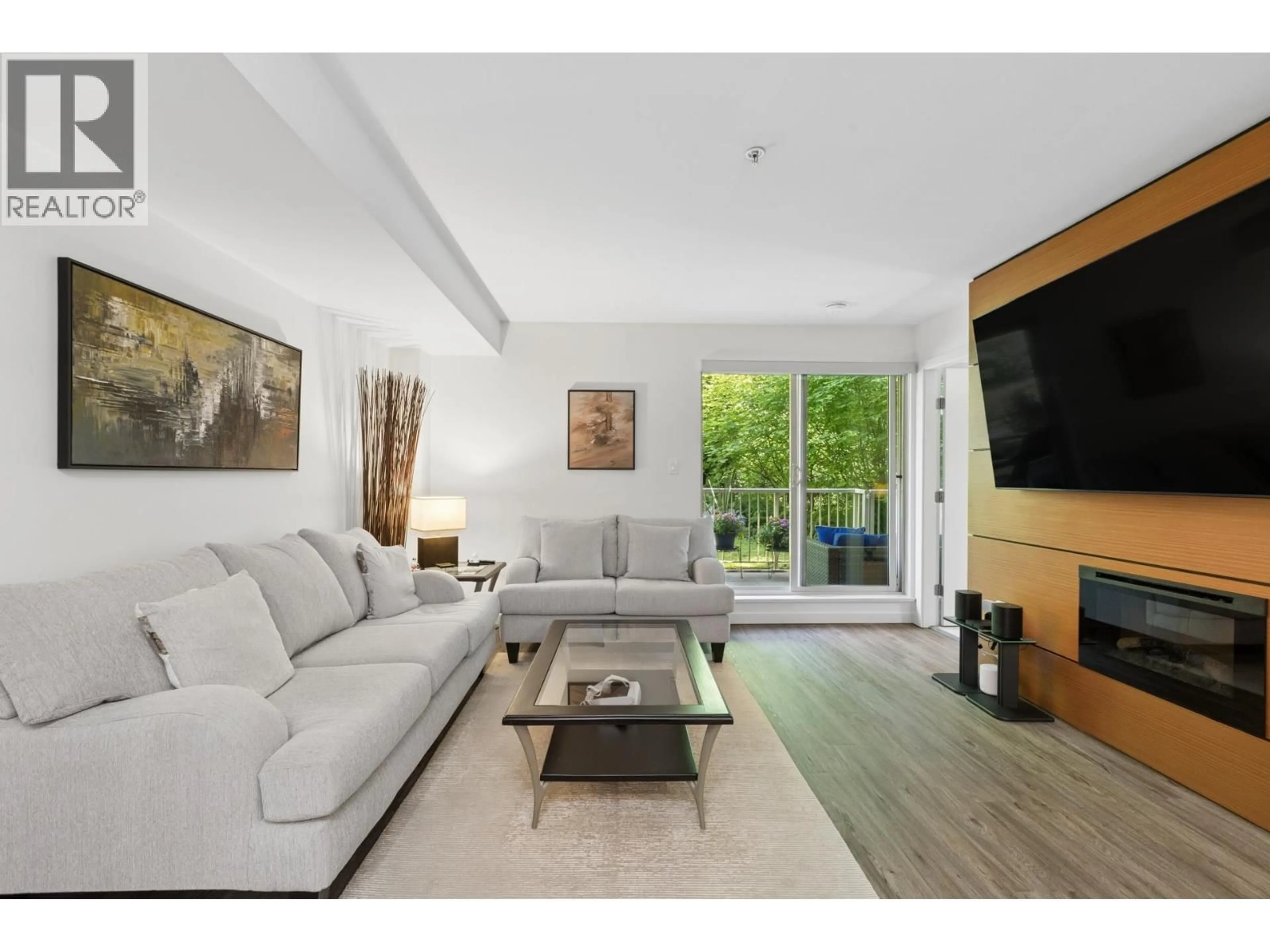 Living room with furniture, unknown for 102 - 2832 CAPILANO ROAD, North Vancouver British Columbia V7R4H5