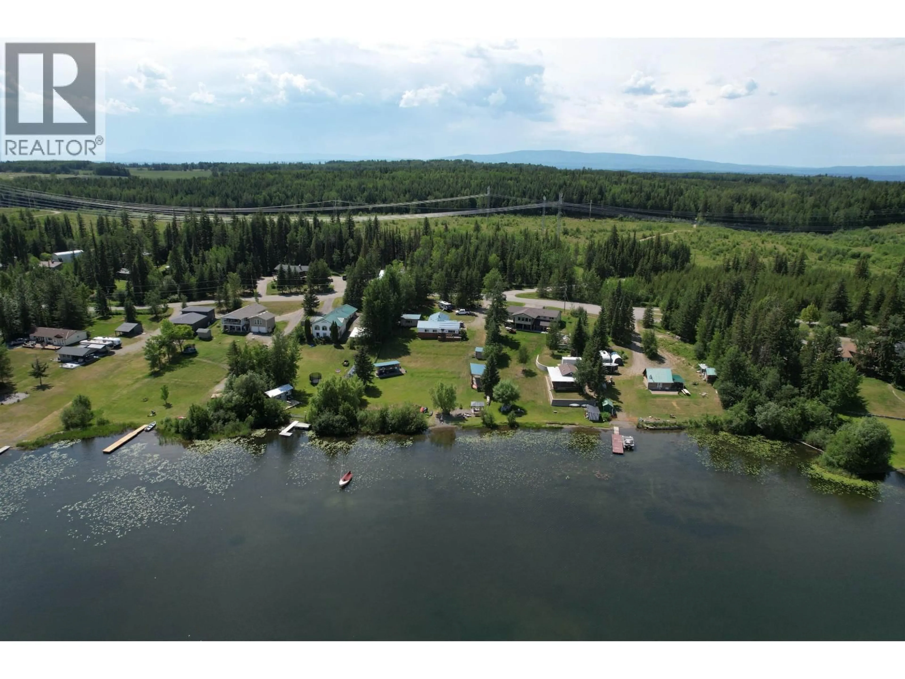 A pic from outside/outdoor area/front of a property/back of a property/a pic from drone, water/lake/river/ocean view for 4856 TEN MILE LAKE ROAD, Quesnel British Columbia V2J6X1