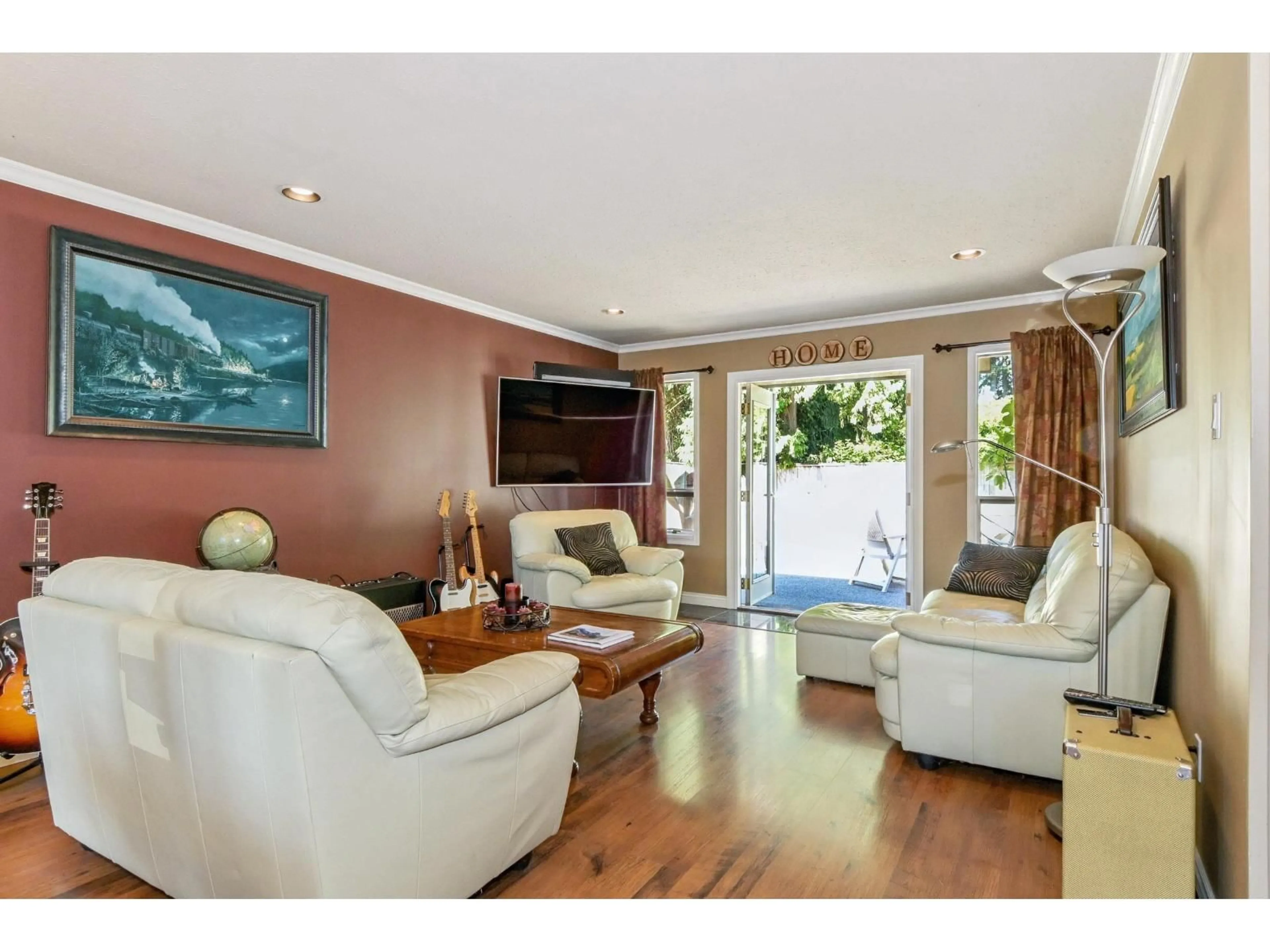 Living room with furniture, wood/laminate floor for 4323 200 STREET, Langley British Columbia V3A1L2