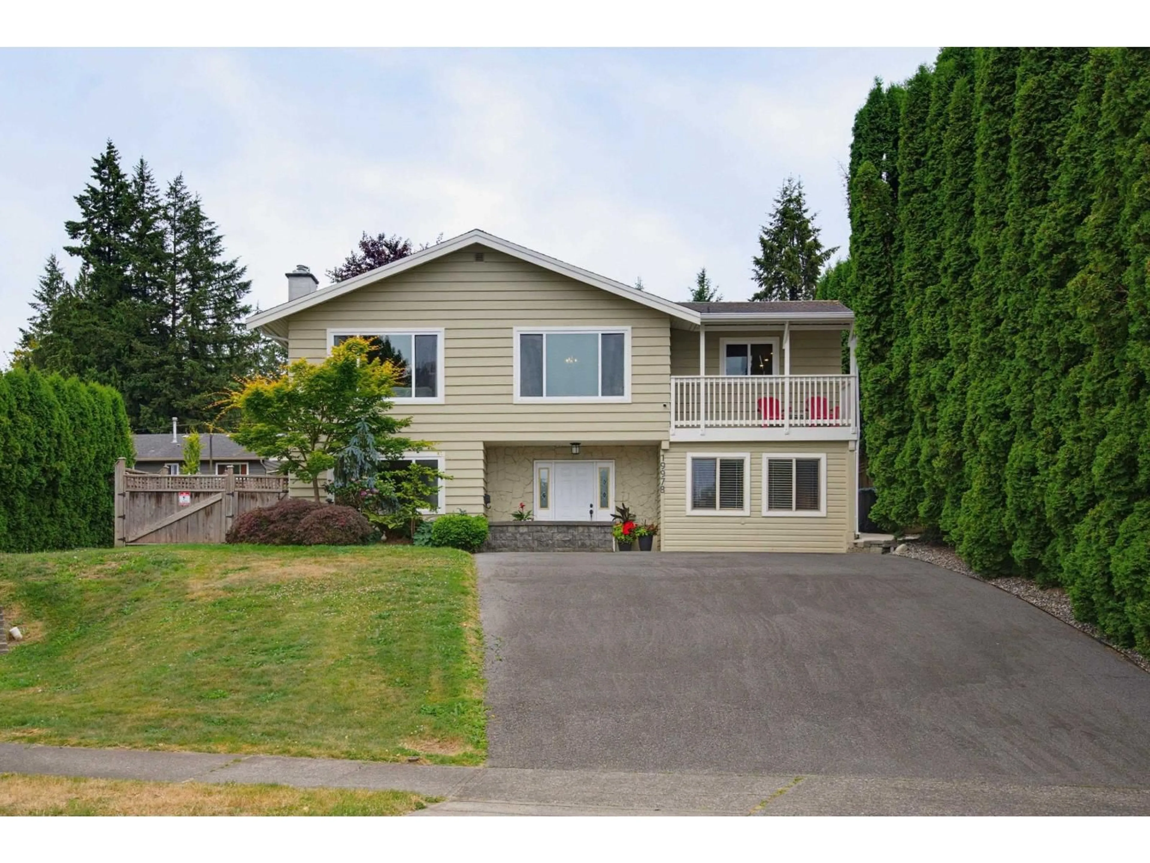 Home with vinyl exterior material, street for 19978 50A AVENUE, Langley British Columbia V3A6S1