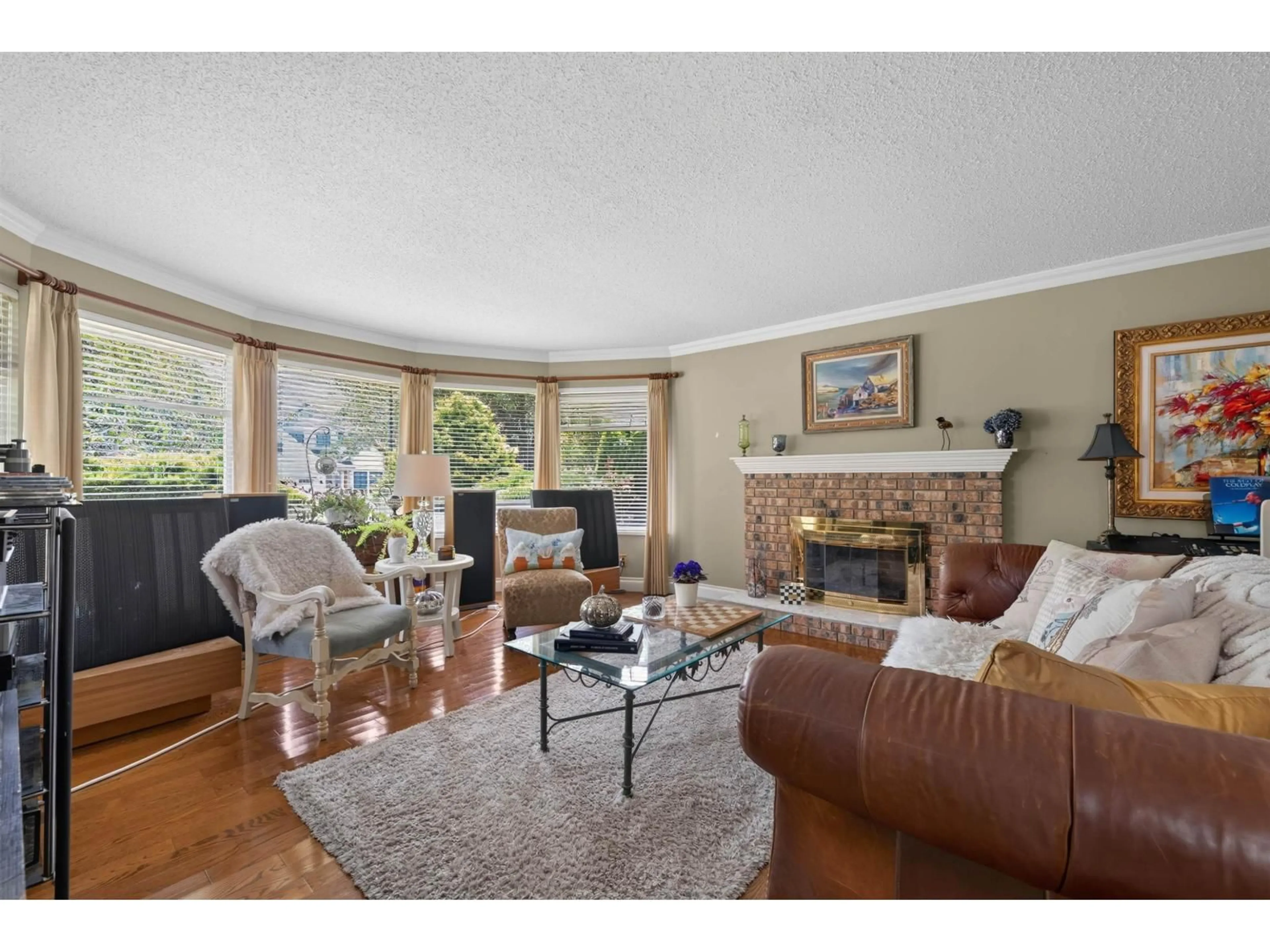 Living room with furniture, wood/laminate floor for 14151 16A AVENUE, Surrey British Columbia V4A6K7