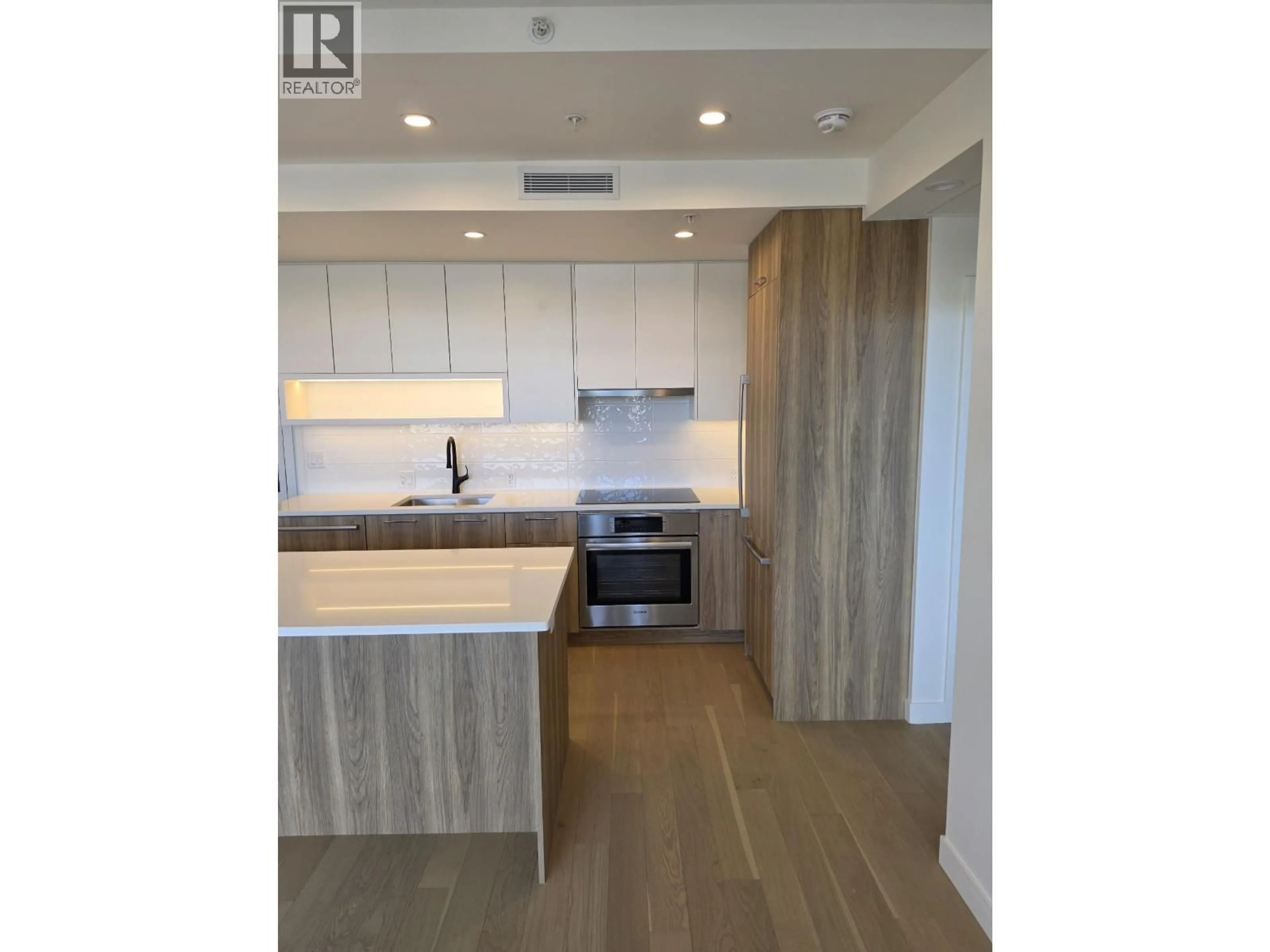 Open concept kitchen, wood/laminate floor for 504 - 8398 OAK STREET, Vancouver British Columbia V6P0L9