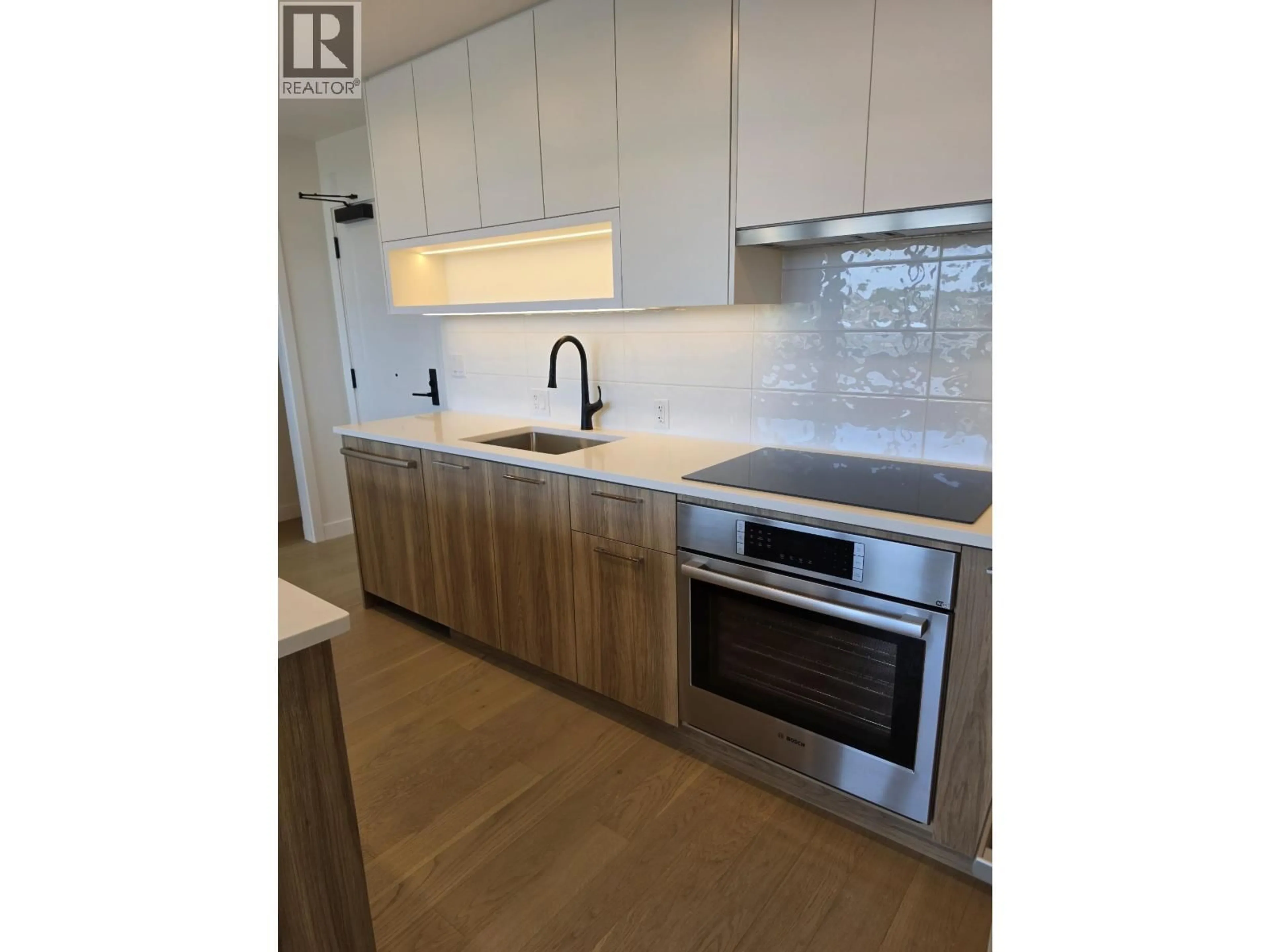 Open concept kitchen, wood/laminate floor for 504 - 8398 OAK STREET, Vancouver British Columbia V6P0L9