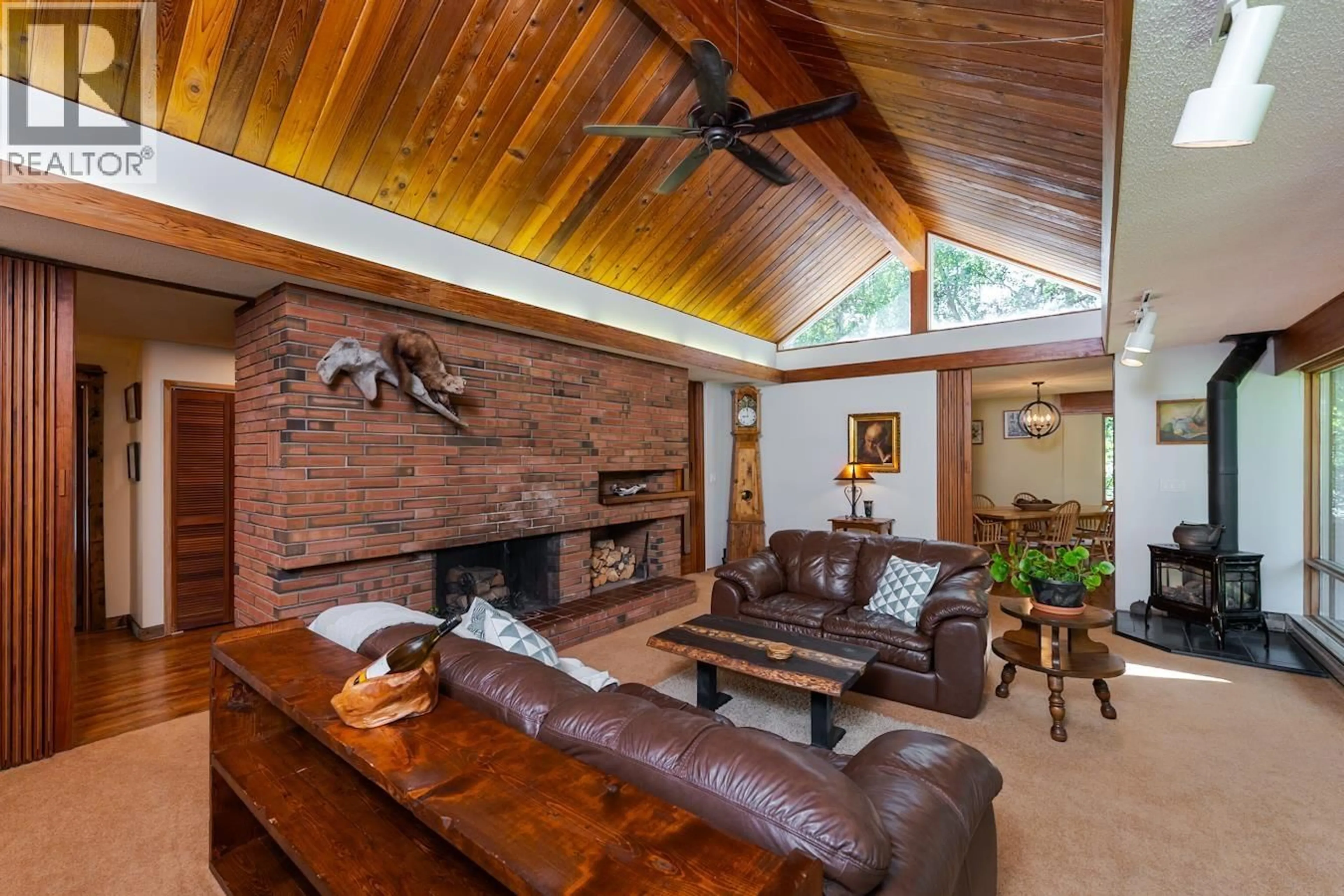 Living room with furniture, wood/laminate floor for 8307 TOOMBS DRIVE, Prince George British Columbia V2K5A3