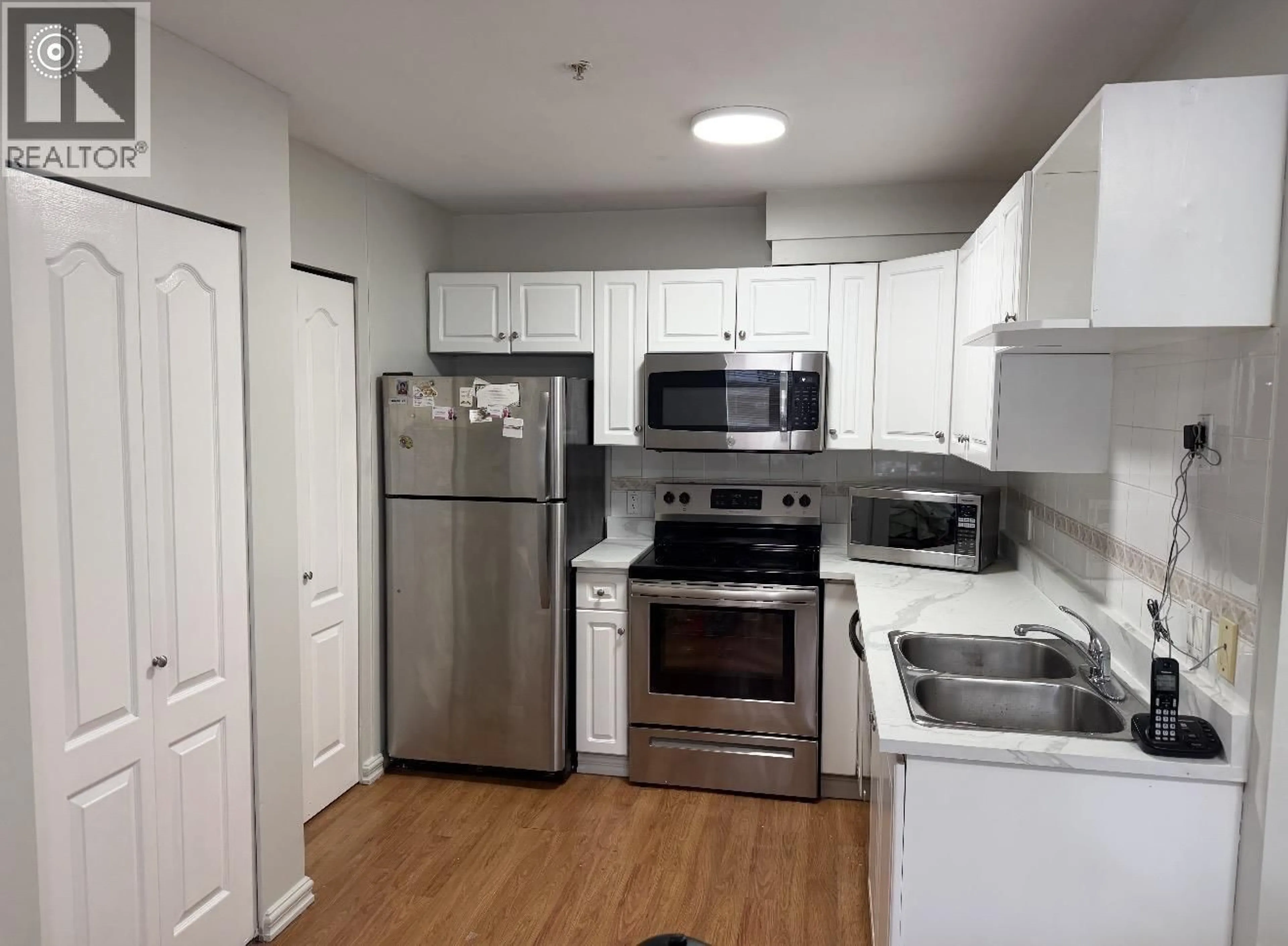 Standard kitchen, wood/laminate floor for 302 - 688 56TH AVENUE, Vancouver British Columbia V5X1R7