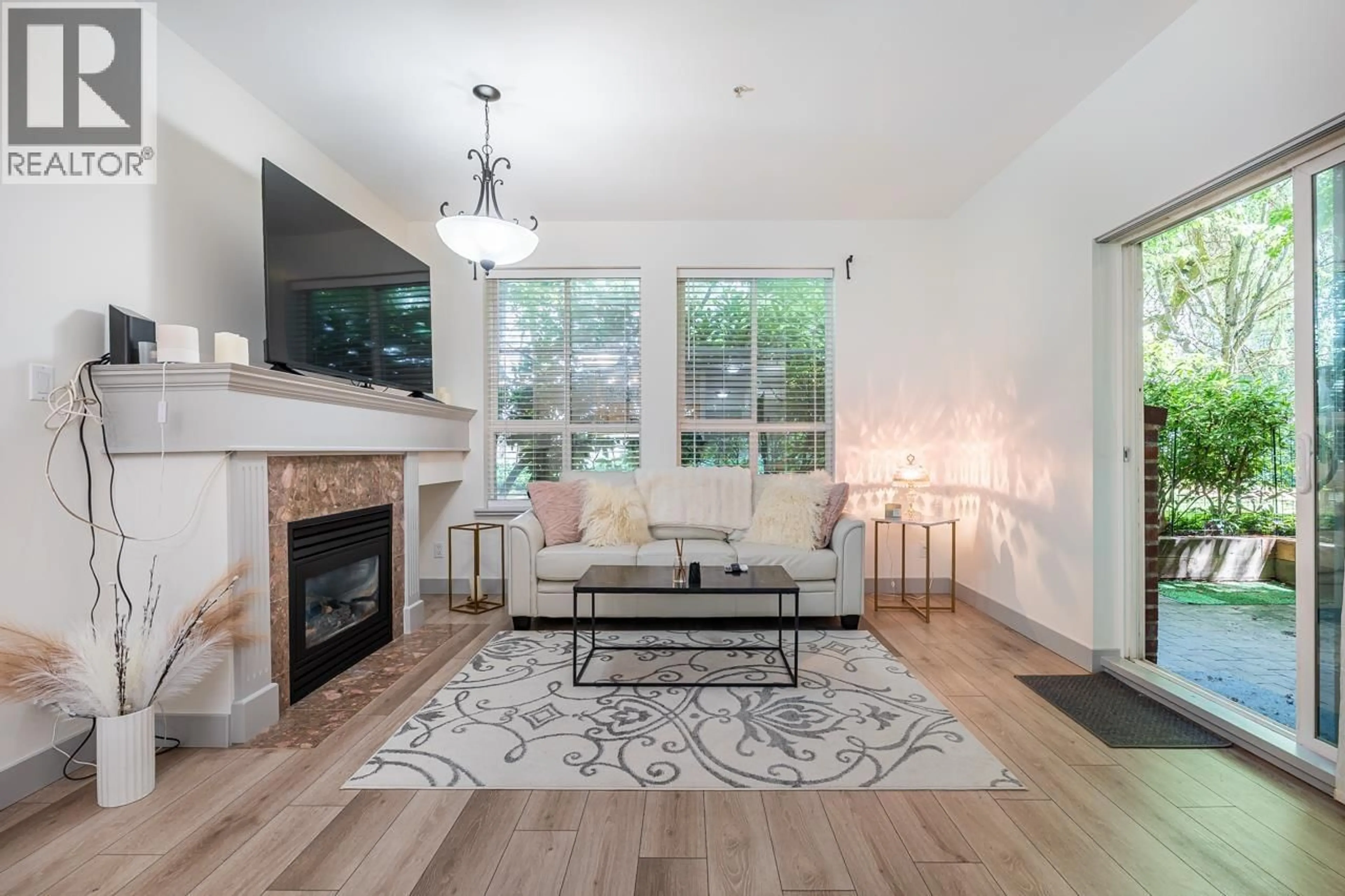 Living room with furniture, wood/laminate floor for 104 - 522 SMITH AVENUE, Coquitlam British Columbia V3J7X7
