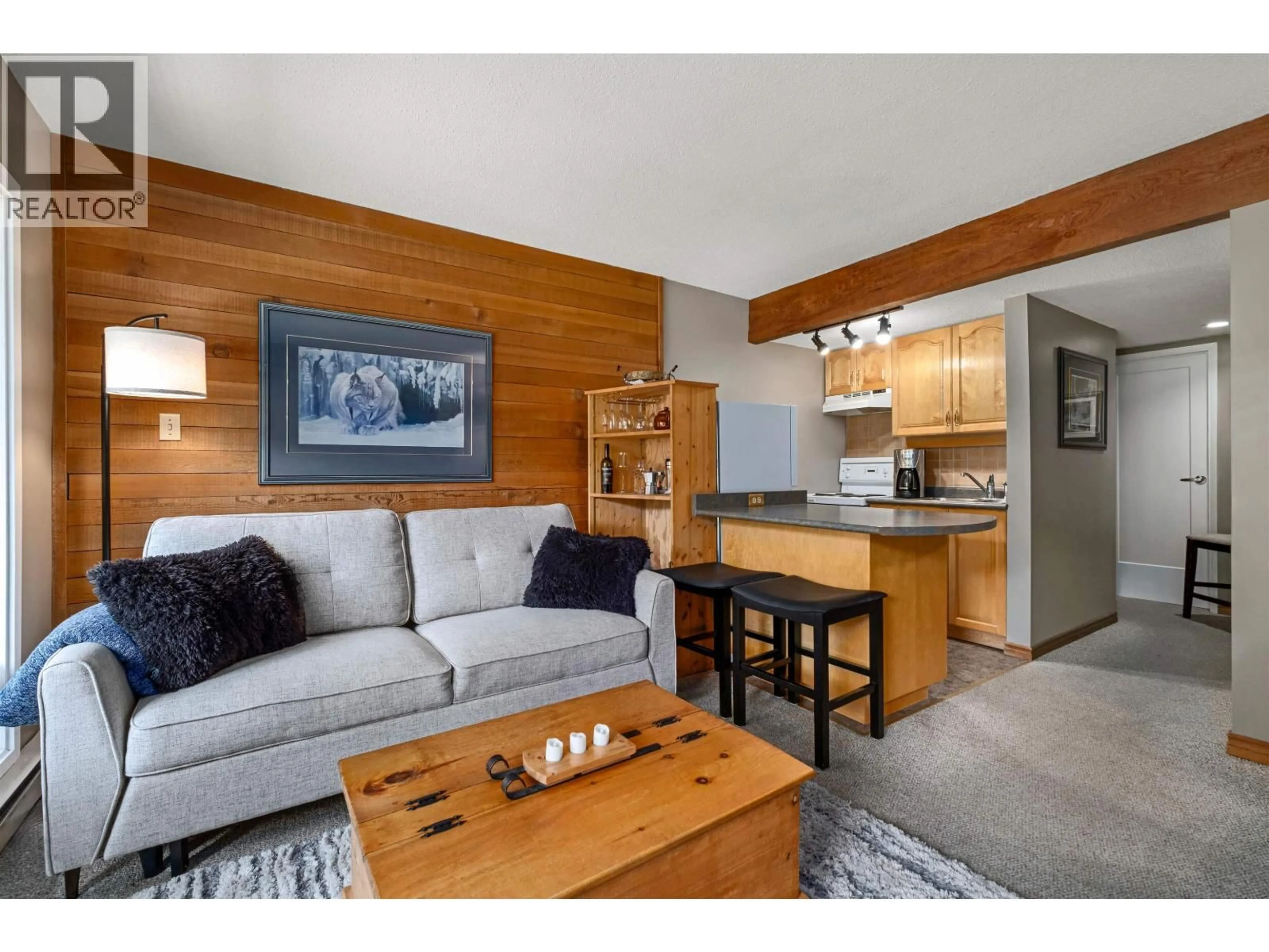 Living room with furniture, wood/laminate floor for 8 - 7001 NESTERS ROAD, Whistler British Columbia V8E0X1