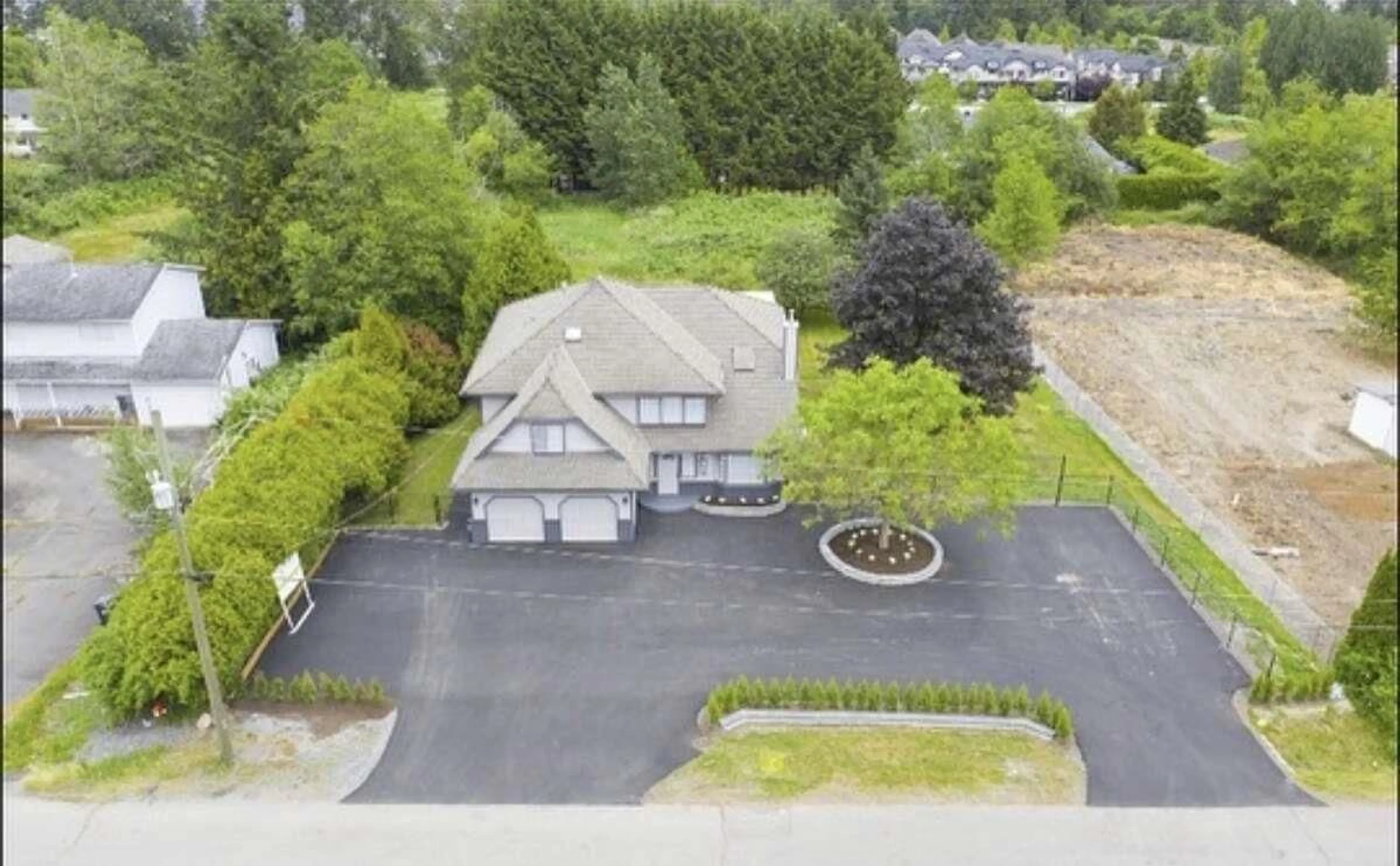 A pic from outside/outdoor area/front of a property/back of a property/a pic from drone, street for 7070 207 STREET, Langley British Columbia V2Y1T4