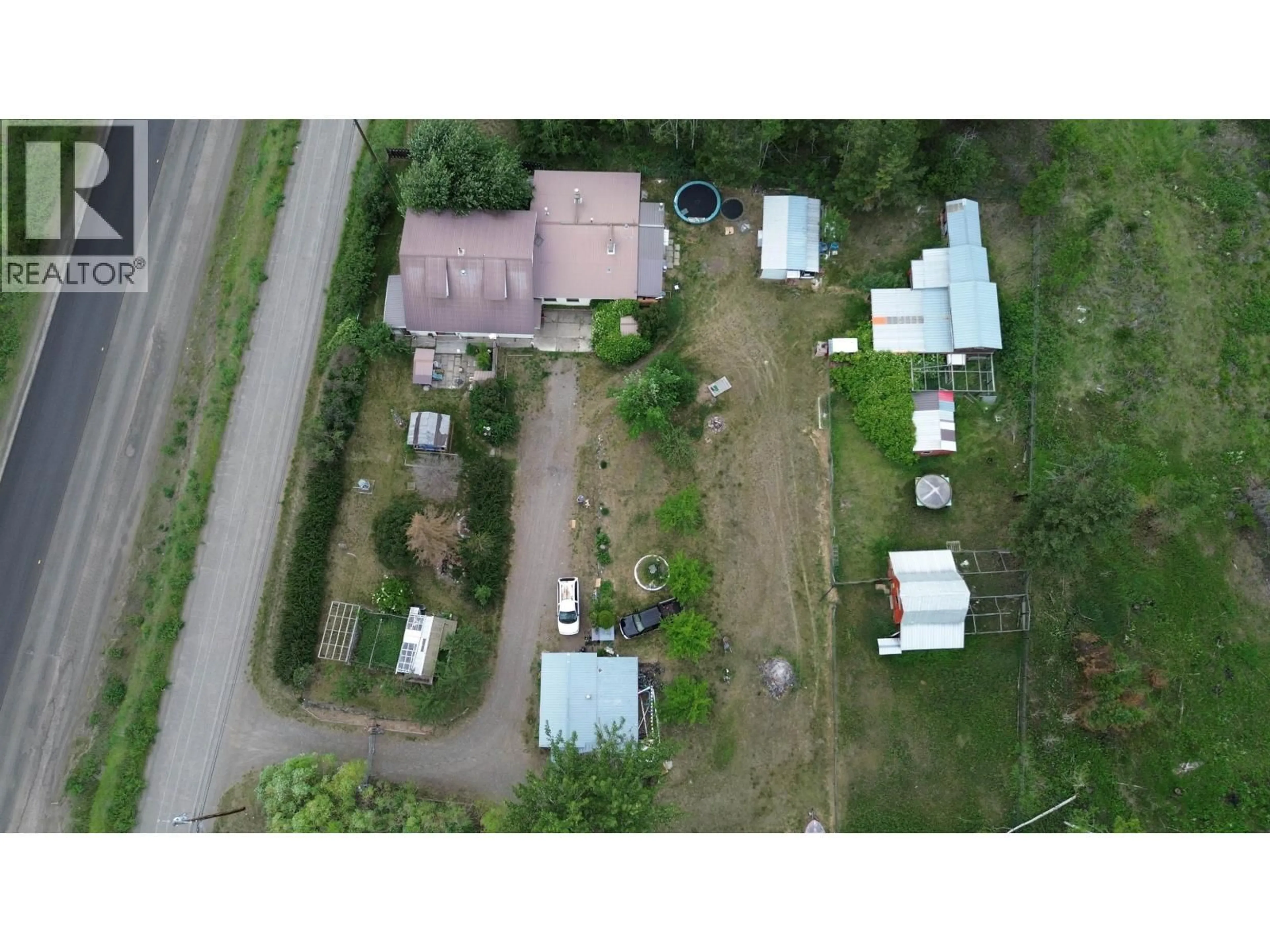A pic from outside/outdoor area/front of a property/back of a property/a pic from drone, street for 3797 DODGE ROAD, Lac La Hache British Columbia V0K1T1