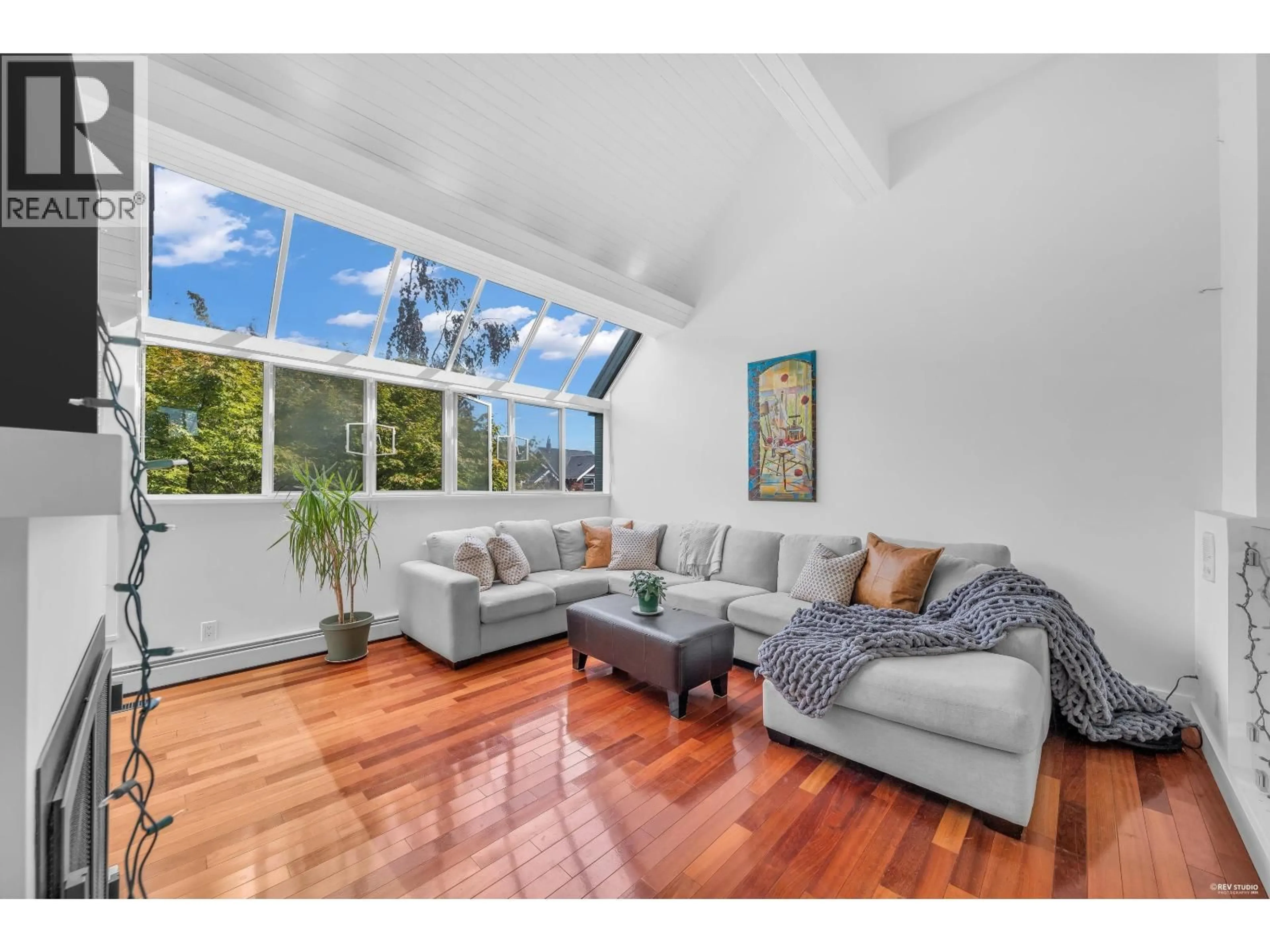 Living room with furniture, wood/laminate floor for 1982 MCNICOLL AVENUE, Vancouver British Columbia V6J1A6